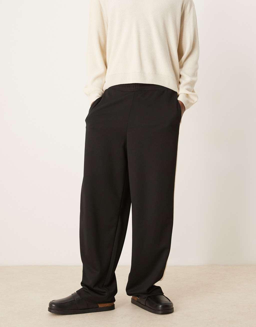 ASOS DESIGN super baggy sweatpants with taping in black Product Image