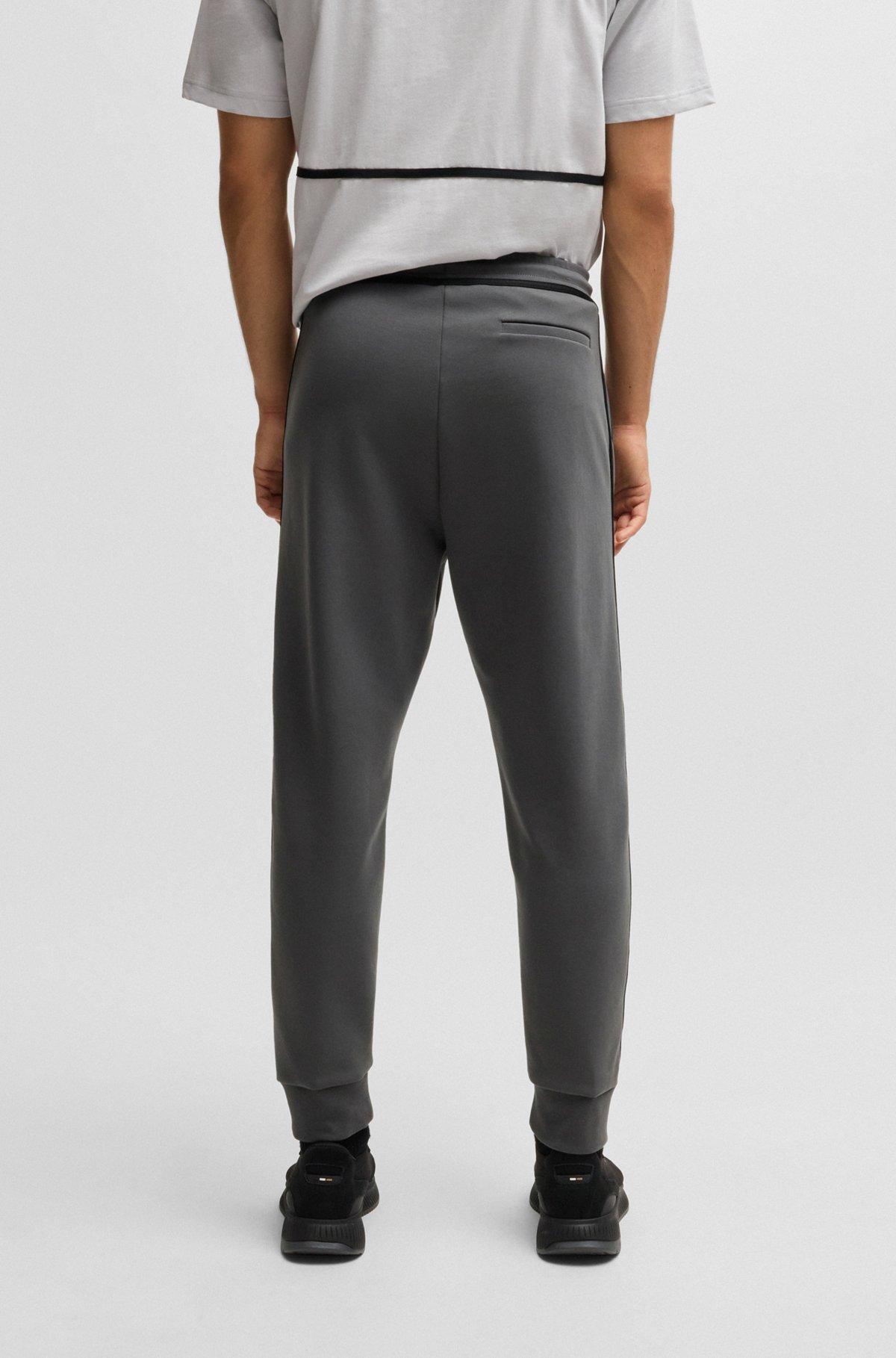 Tracksuit bottoms with tape and logo Product Image