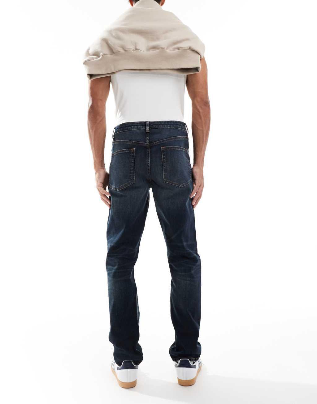 ASOS DESIGN slim jeans with tint in dark wash blue Product Image