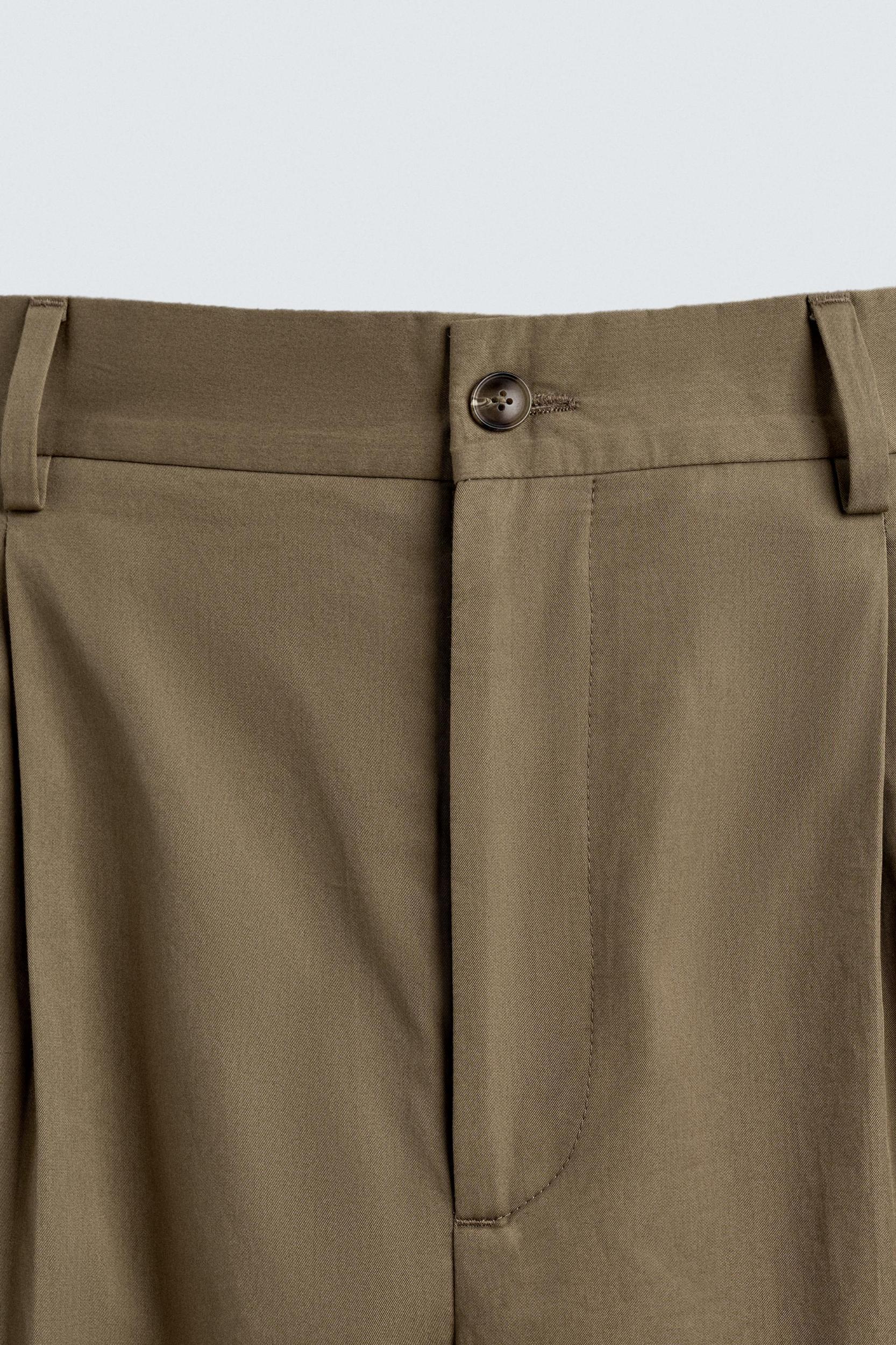 LIMITED EDITION RELAXED FIT PLEATED PANTS Product Image