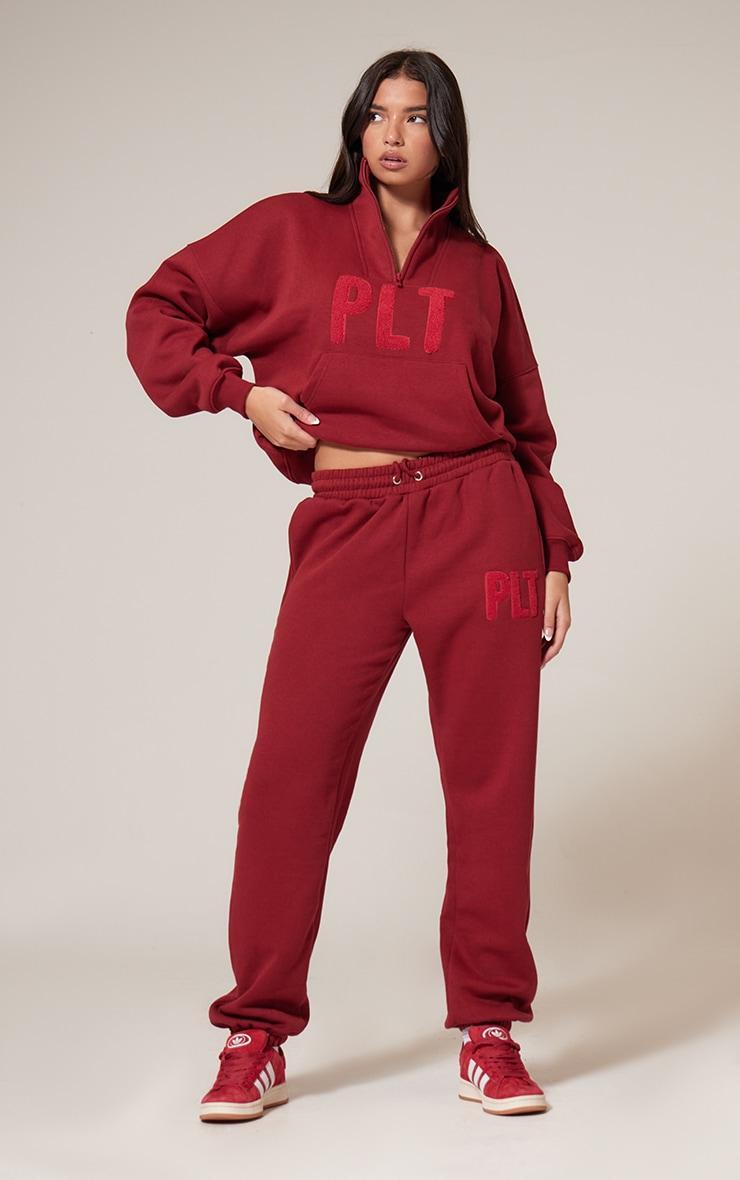 PRETTYLITTLETHING Dark Red Borg Applique Quarter Zip Sweatshirt Product Image