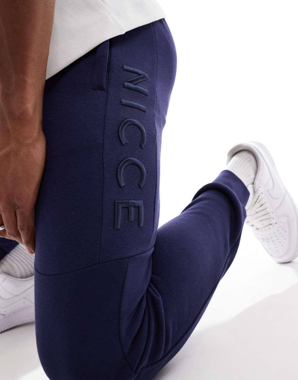 Nicce logo sweatpants in navy Product Image