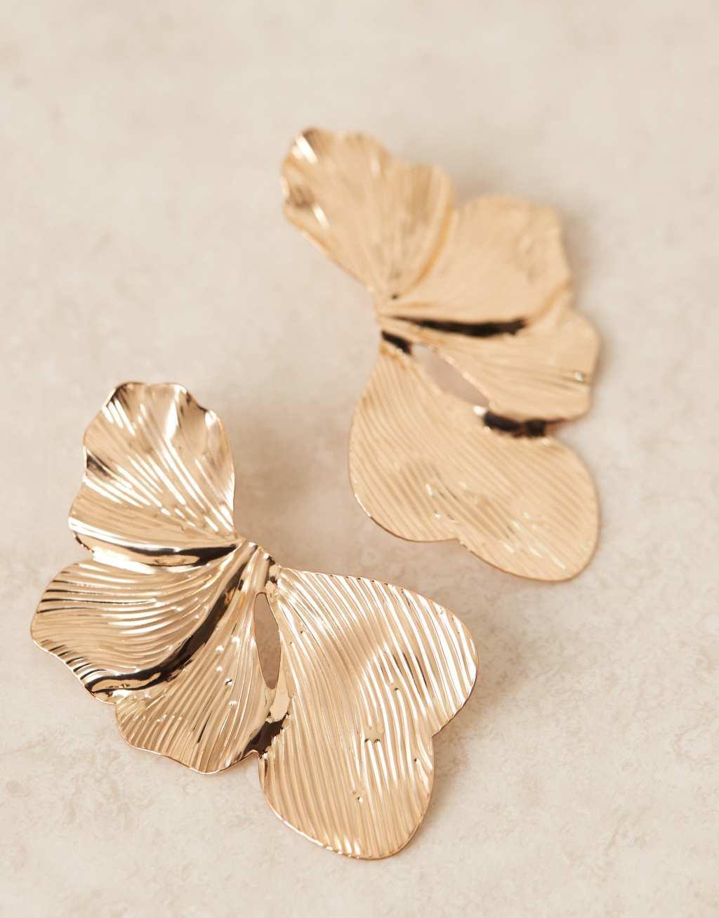 ASOS DESIGN stud earrings with oversized floral petal detail in gold tone Product Image