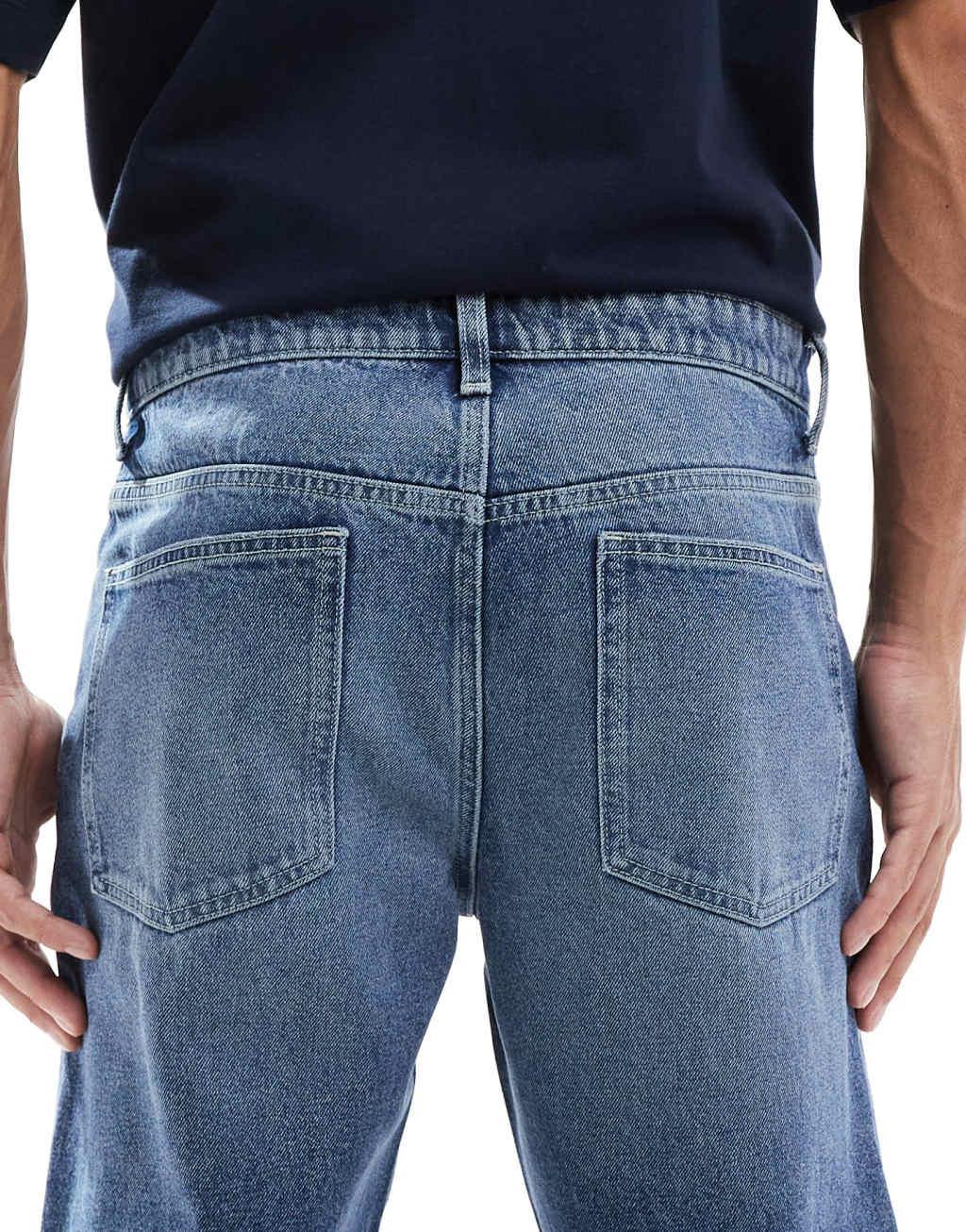 ASOS DESIGN tapered fit jeans in mid wash blue | ASOS Product Image