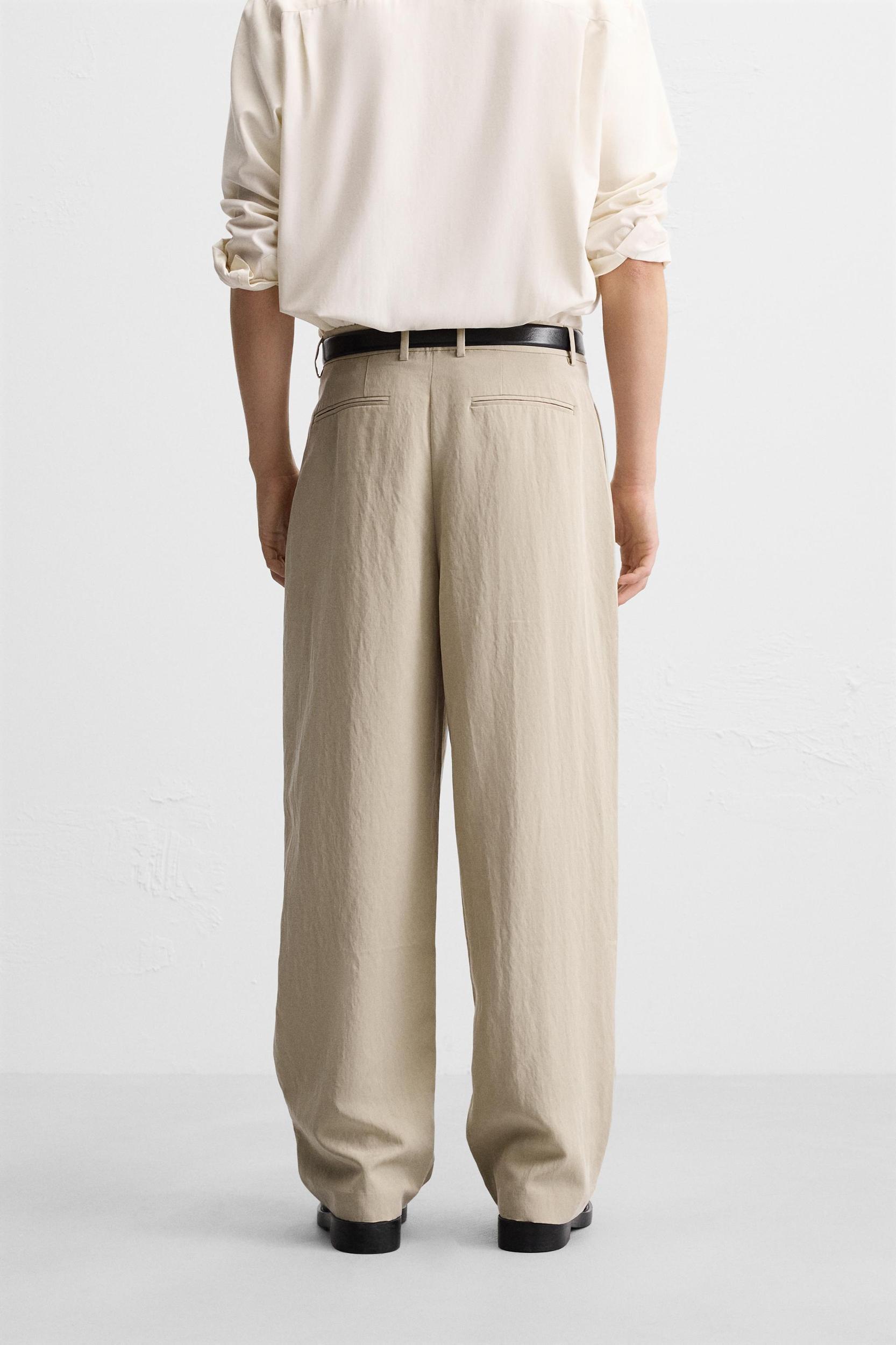 PLEATED WIDE FIT PANTS Product Image