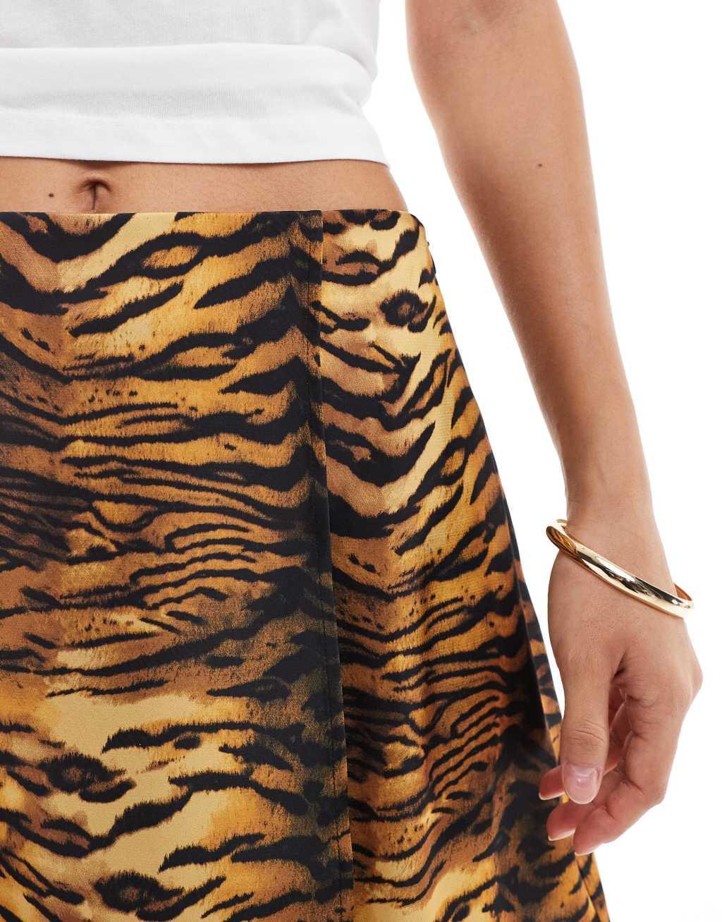 ASOS DESIGN wrap satin mini skirt in animal print Product Image