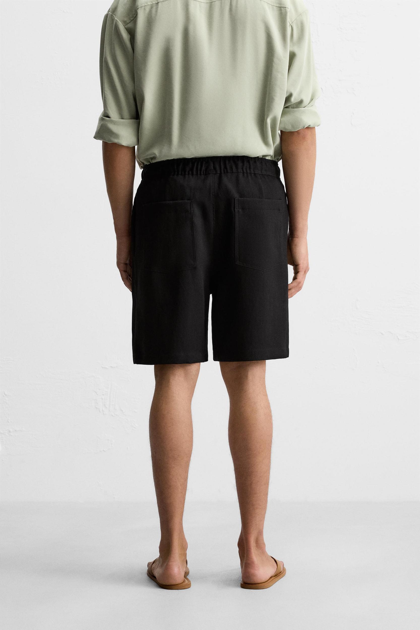 PLEATED FLOWY SHORTS Product Image
