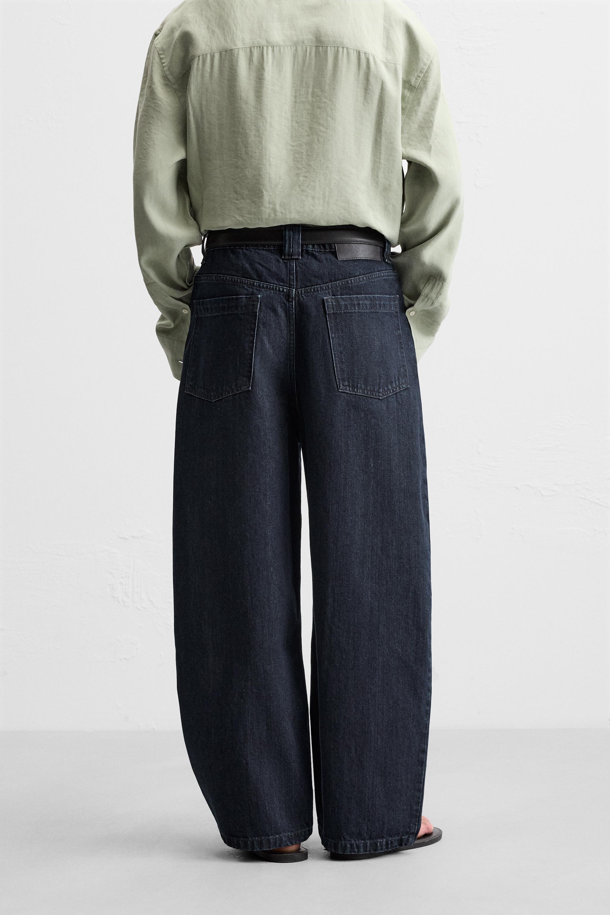 PLEATED WIDE LEG JEANS Product Image