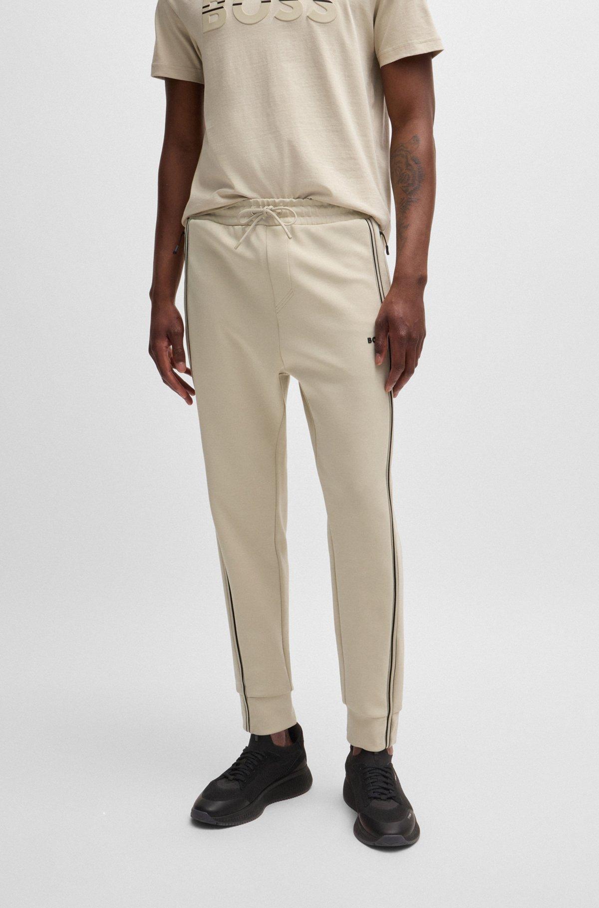 Tracksuit bottoms with tape inserts Product Image