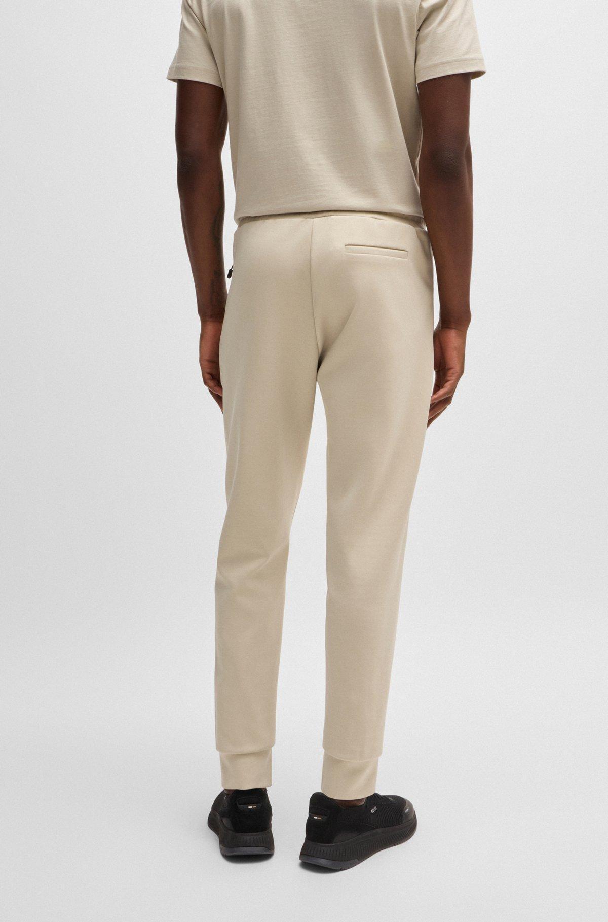 Tracksuit bottoms with tape inserts Product Image