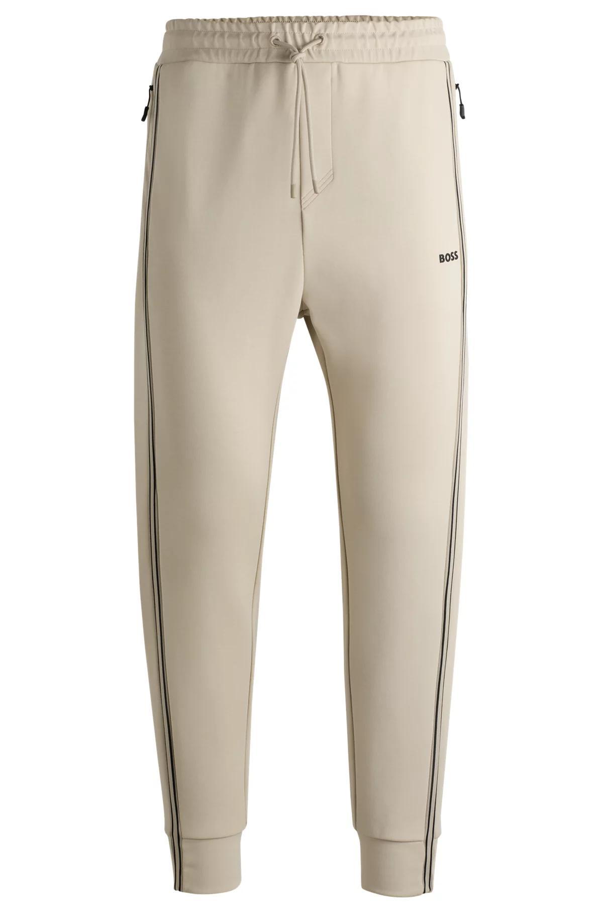 Tracksuit bottoms with tape inserts Product Image