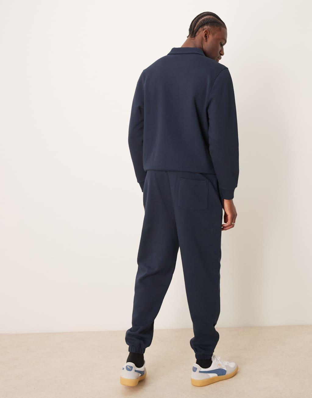 ASOS DESIGN tapered pin tuck sweatpants in navy - part of a set Product Image