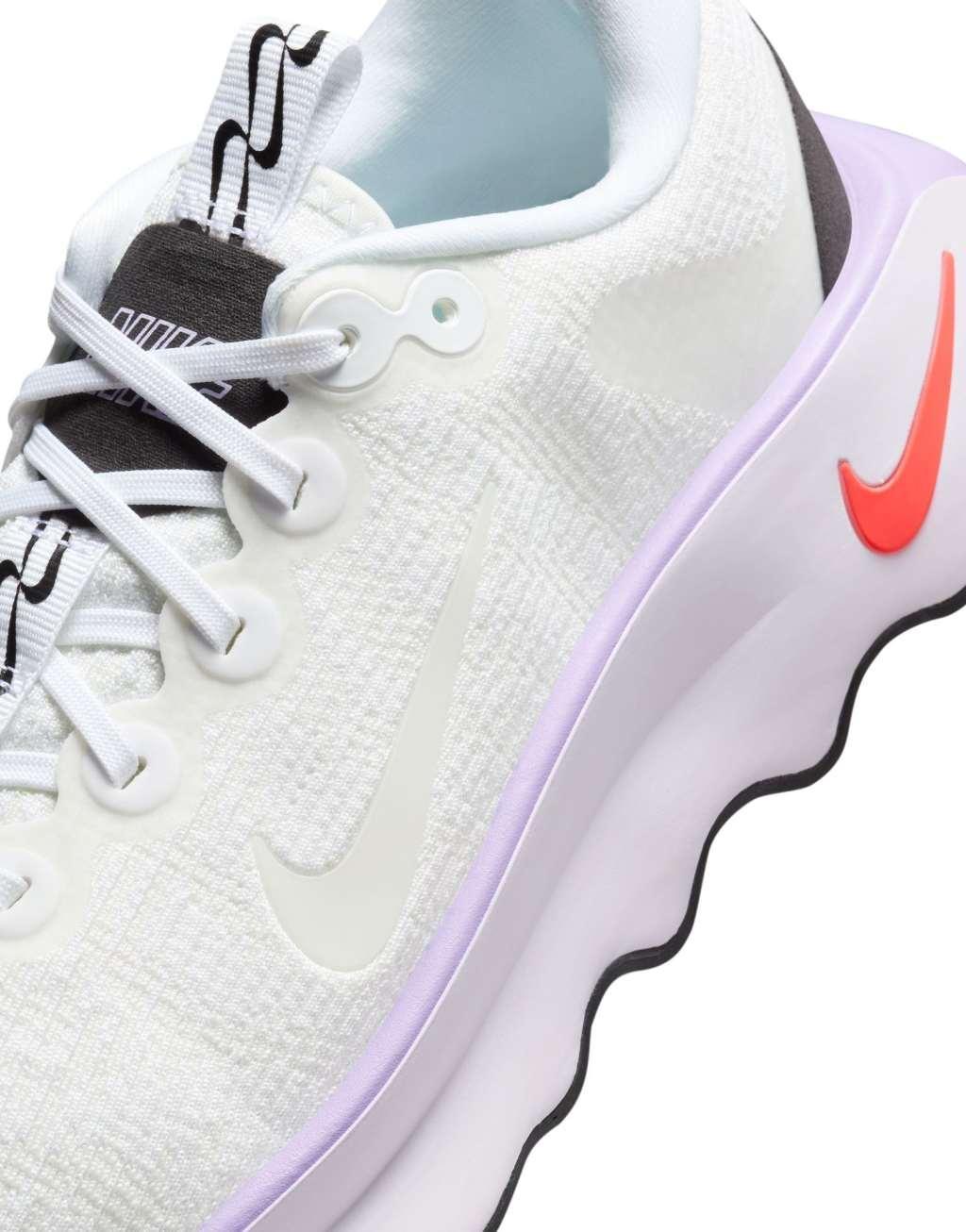 Nike Training Motiva sneakers in white and pink Product Image