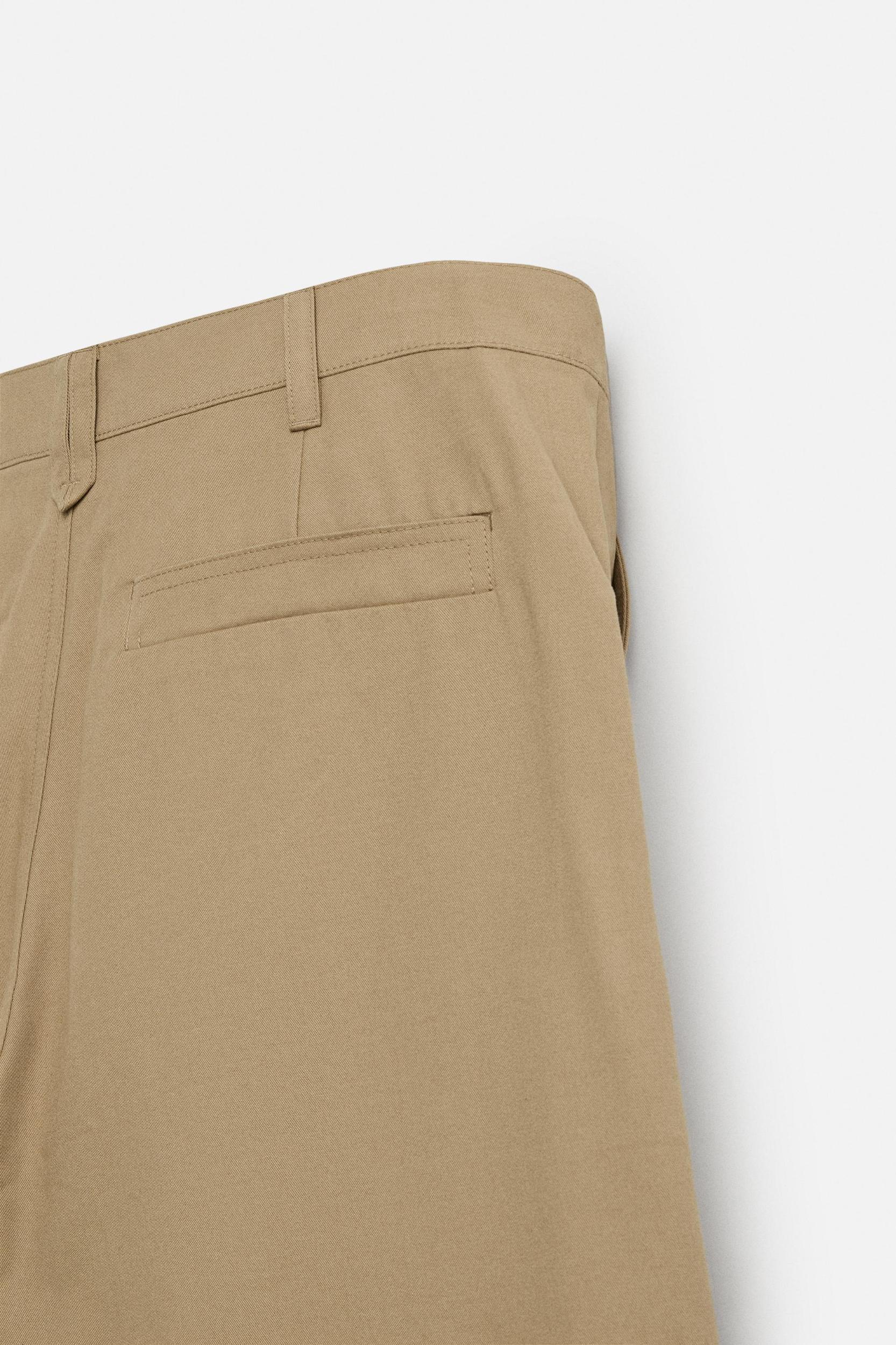 PLEATED WIDE FIT PANTS Product Image