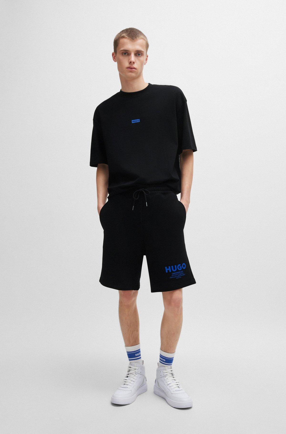 Loose-fit shorts in cotton terry with logo print Product Image