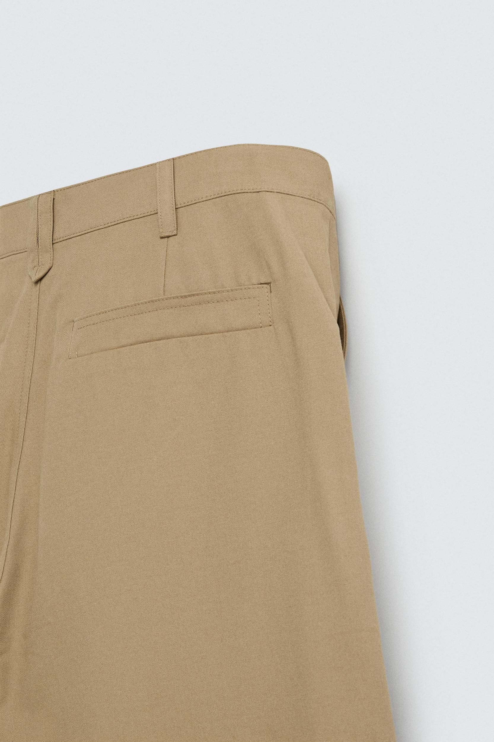 PLEATED WIDE FIT PANTS Product Image