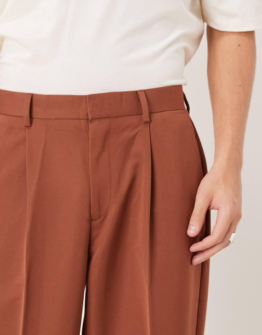 ASOS DESIGN oversized tapered dress pants with front pleat in rust Product Image