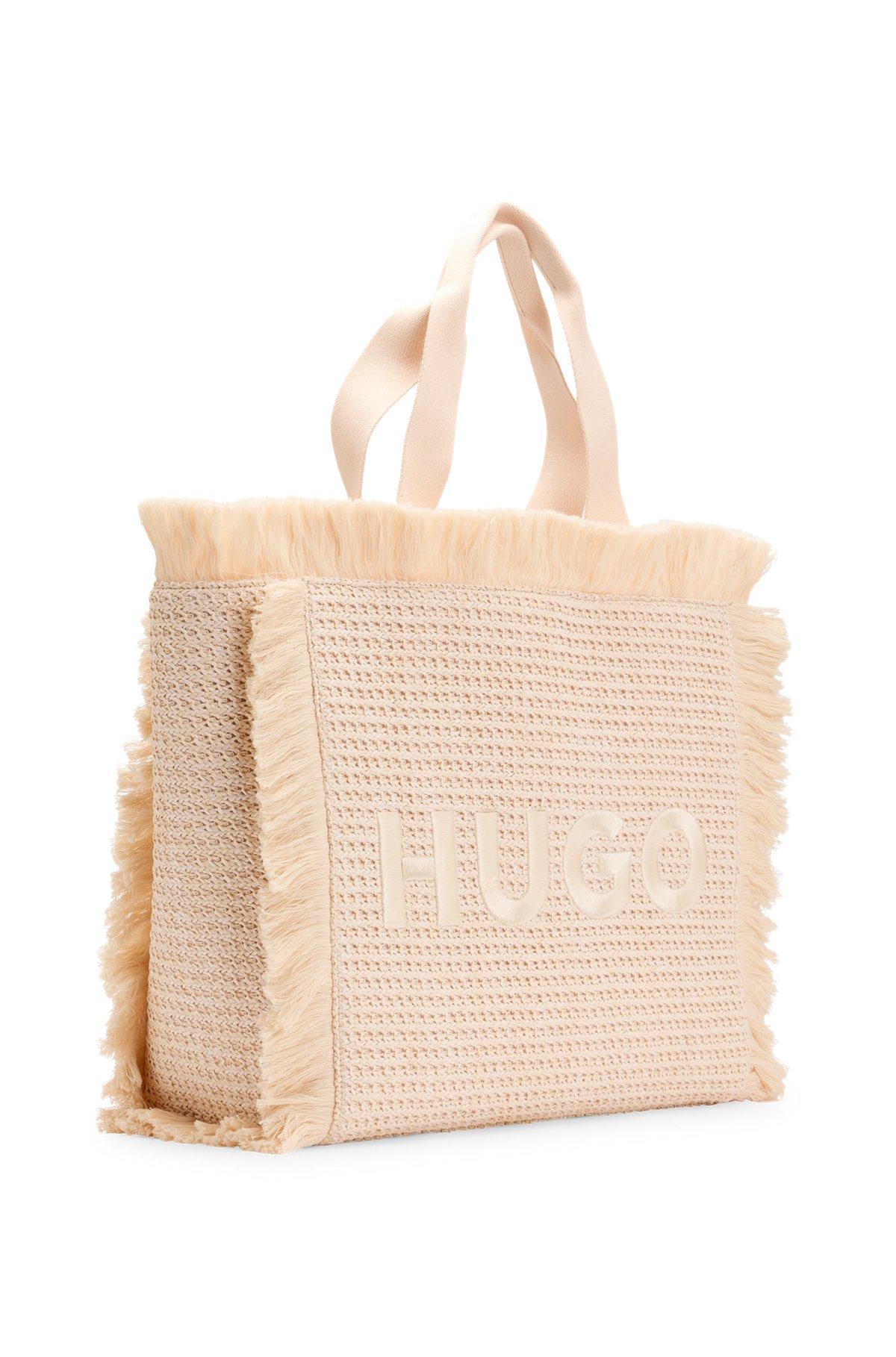 Logo-embroidered raffia-effect tote bag with fringe trims Product Image