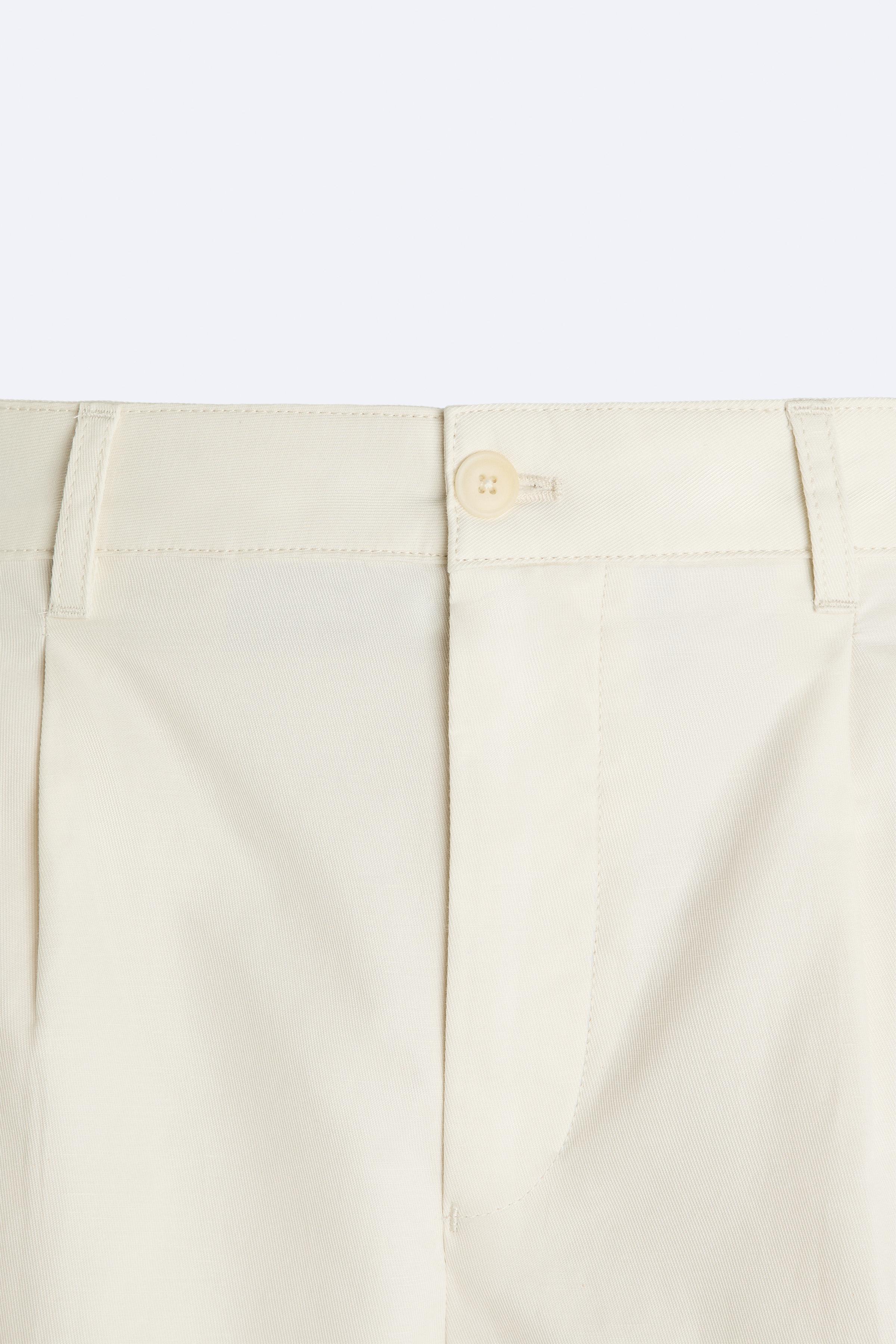 PLEATED WIDE FIT SHORTS Product Image