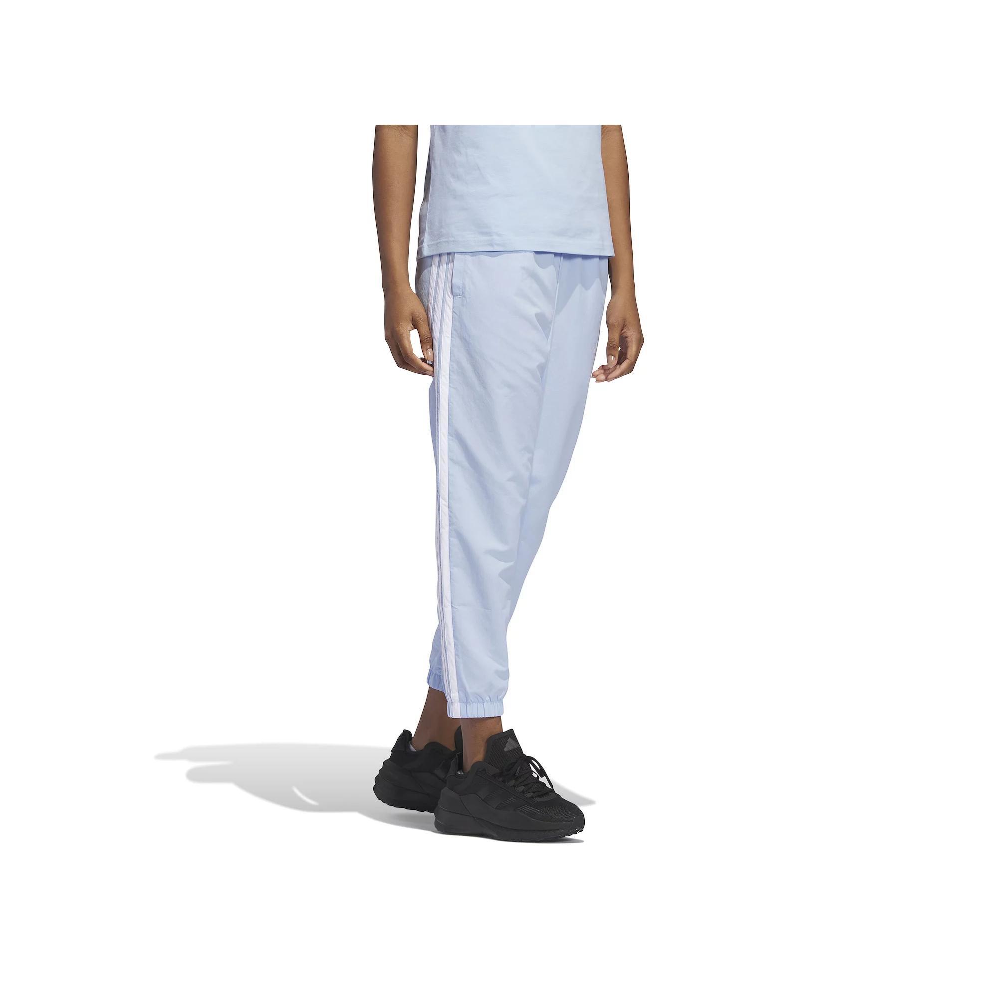 Women's adidas Essentials 3-Stripes Woven 7/8 Sportswear Pants, Size: Medium, Glow Blue Product Image