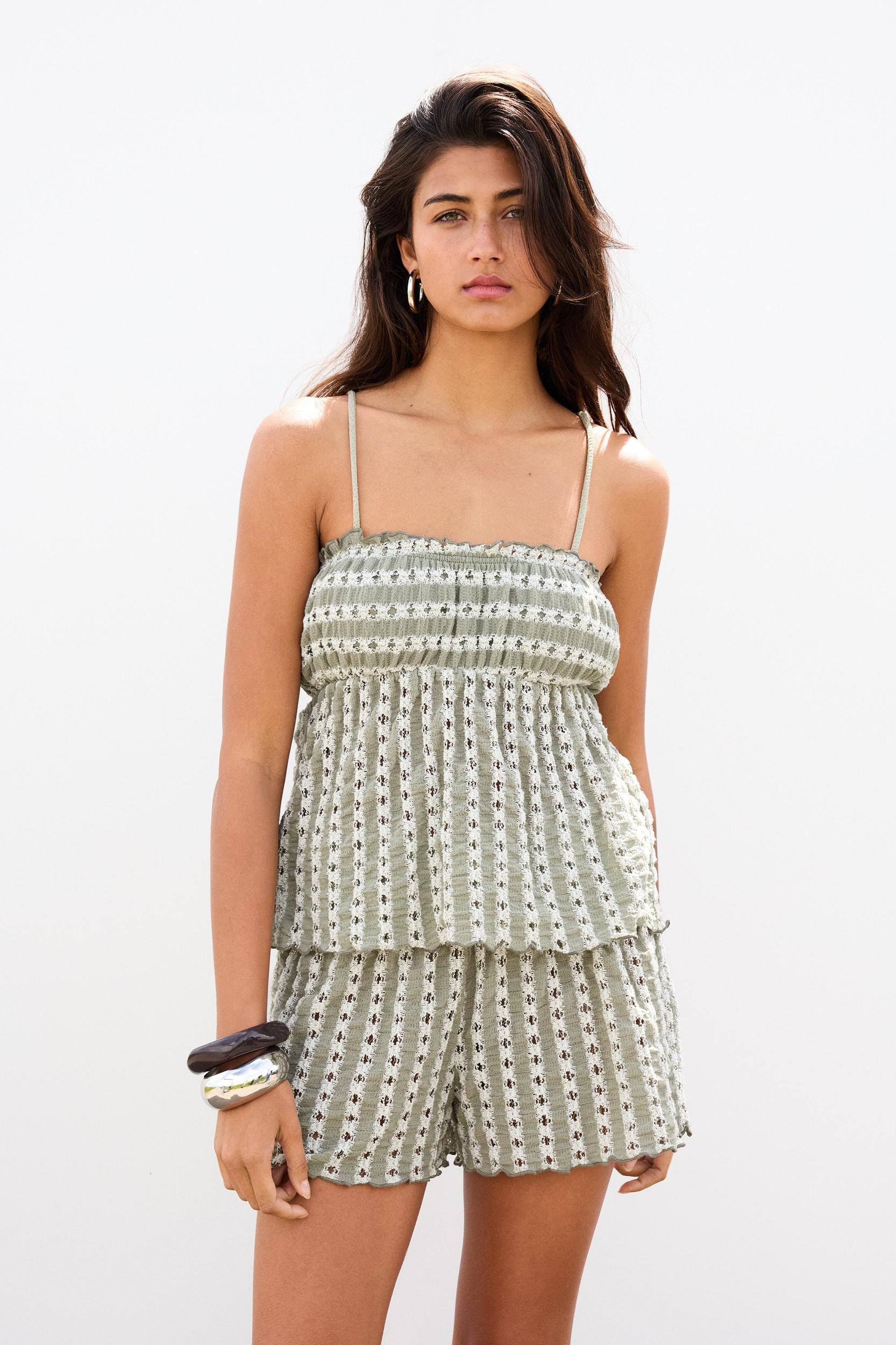 Open-knit top with bows Product Image