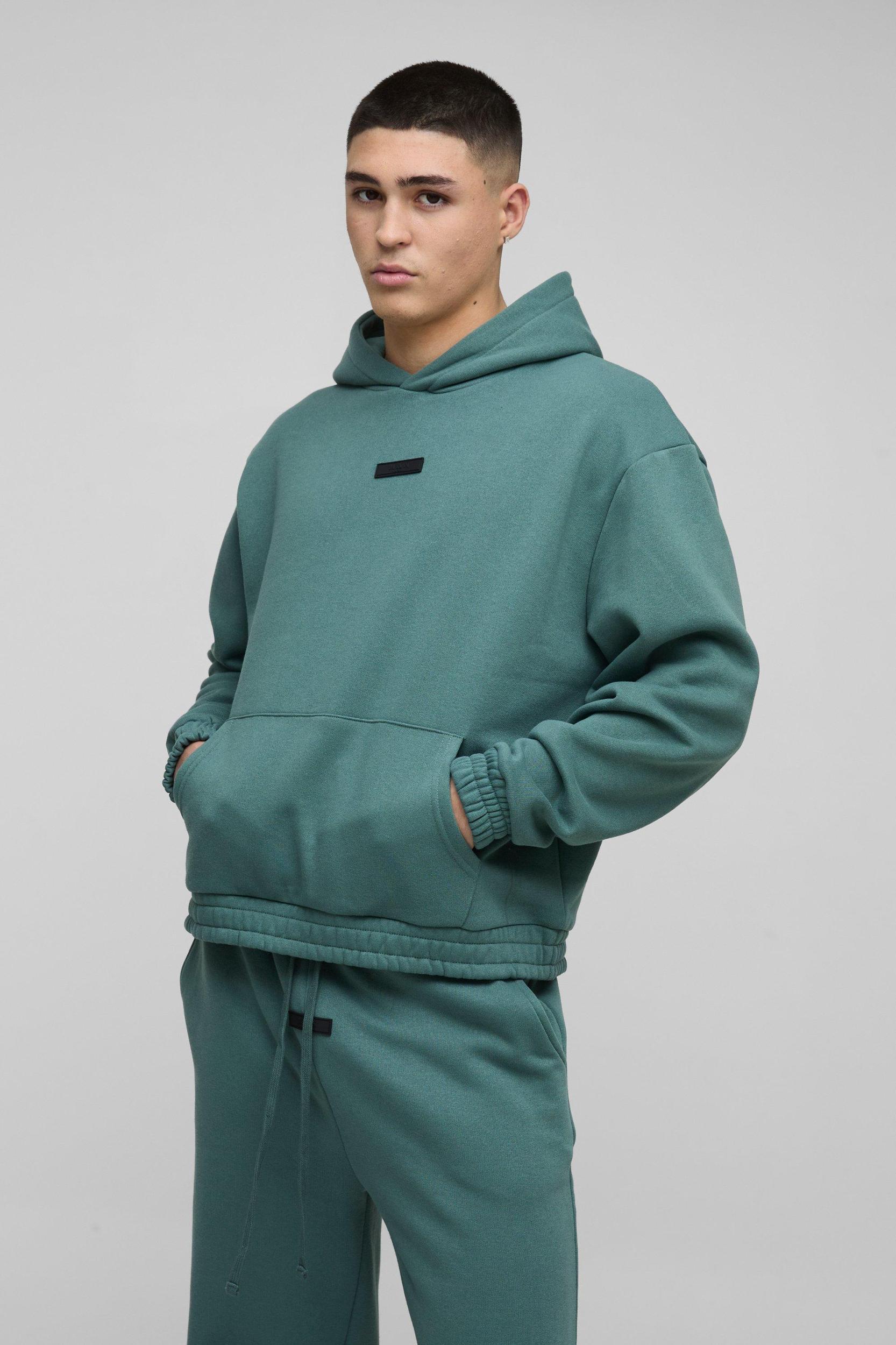 Oversized Boxy Flare Stacked Hooded Tracksuit With Rubber Badge | boohooMAN USA Product Image