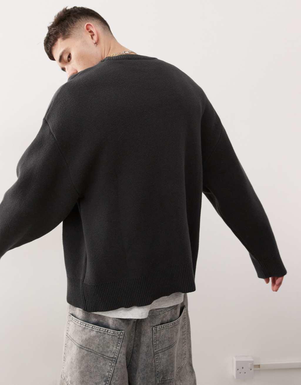 Weekday Cypher oversized sweater with star jacquard graphic in dark gray Product Image