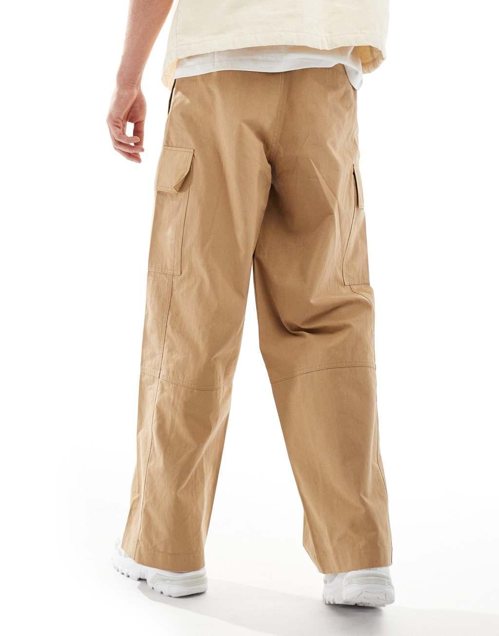 ASOS DESIGN loose fit cargo pants with seam detail in tan Product Image