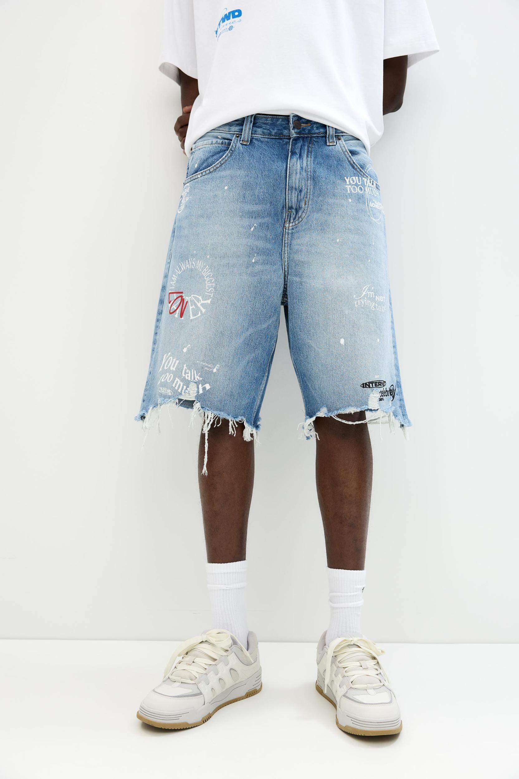 Ripped denim Bermuda shorts Product Image