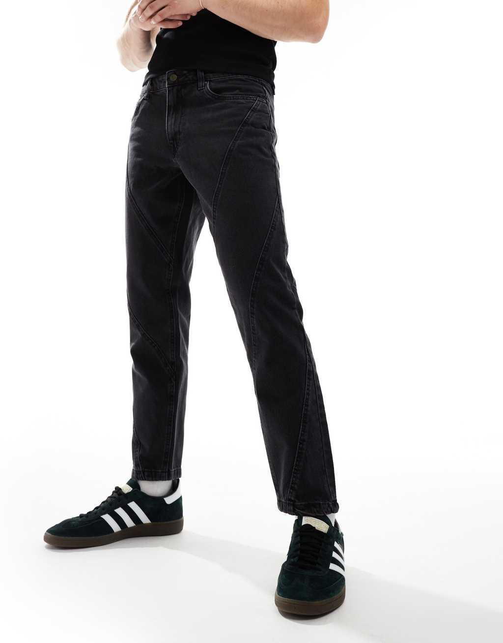 ASOS DESIGN tapered fit jeans with paneling detail in washed black Product Image