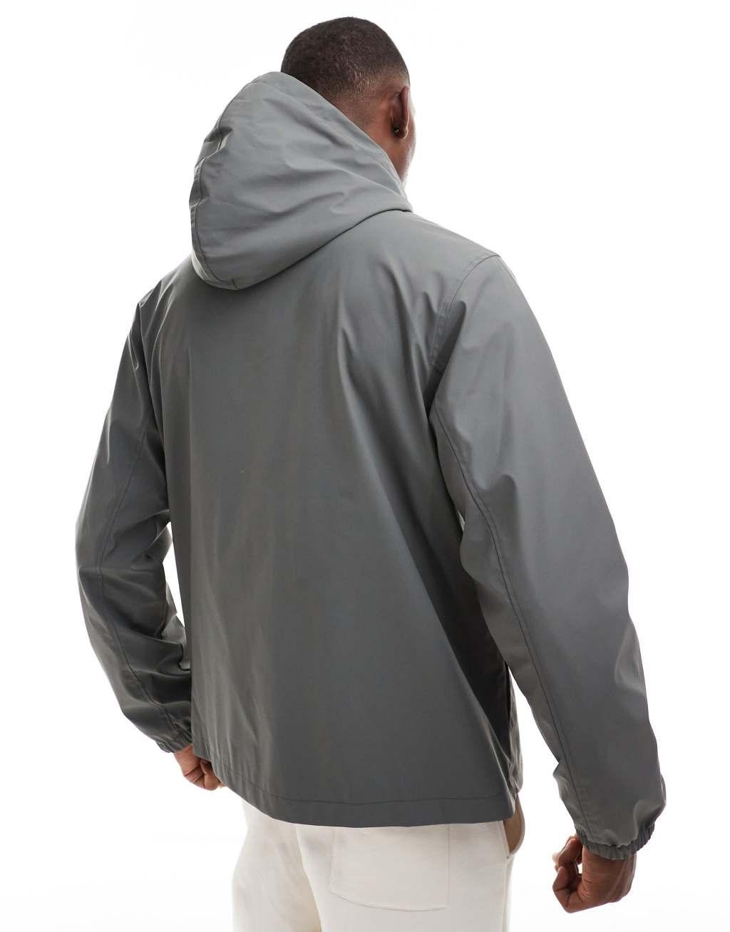 ASOS DESIGN rubberized rain jacket with chest pockets in charcoal Product Image