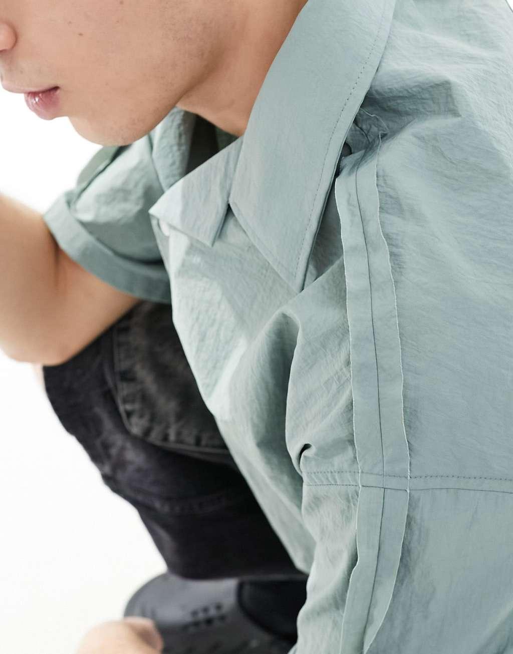 COLLUSION techy short sleeve revere shirt with raw seam detail in blue Product Image