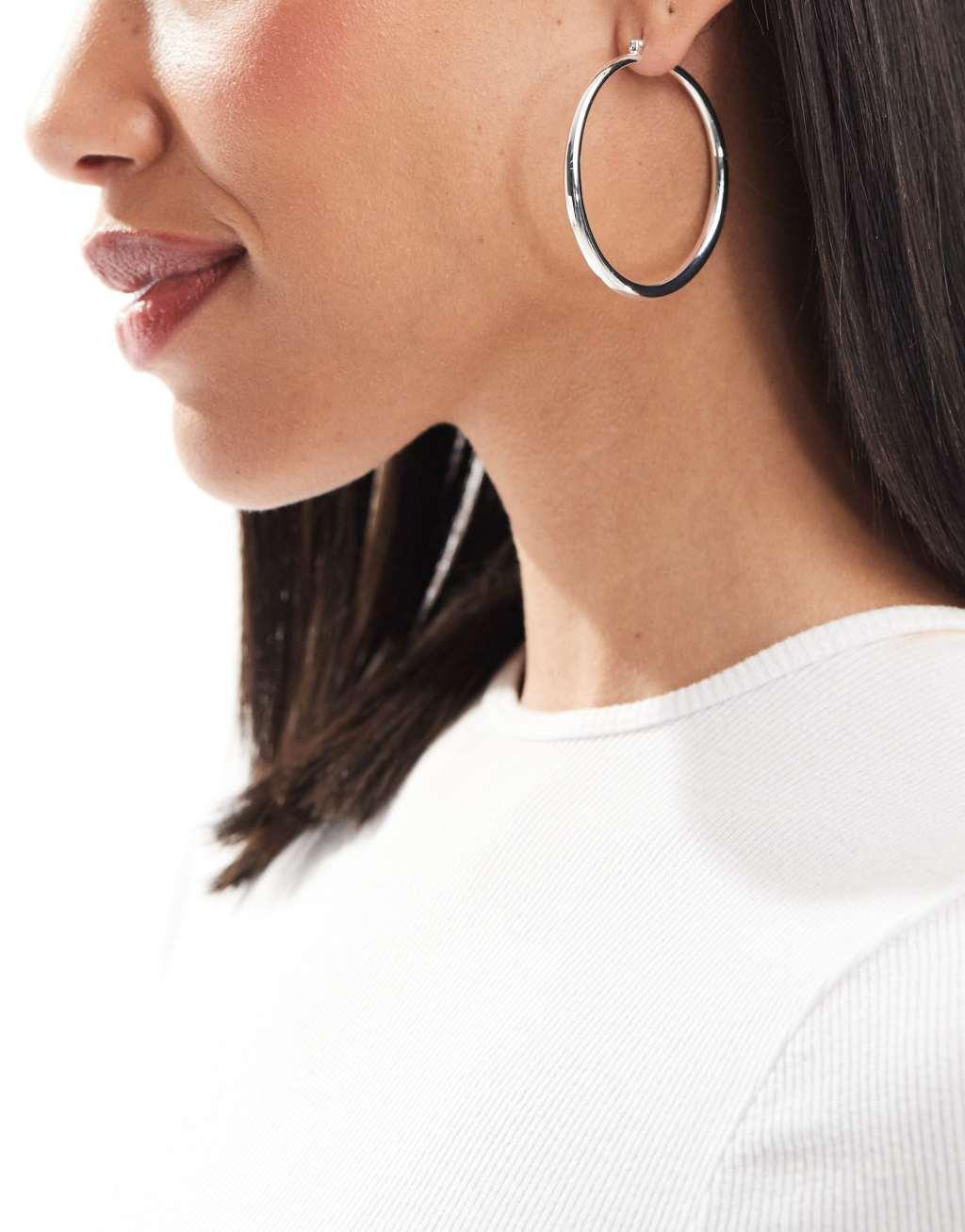 ASOS DESIGN silver plated earrings with graduated skinny hoop detail Product Image