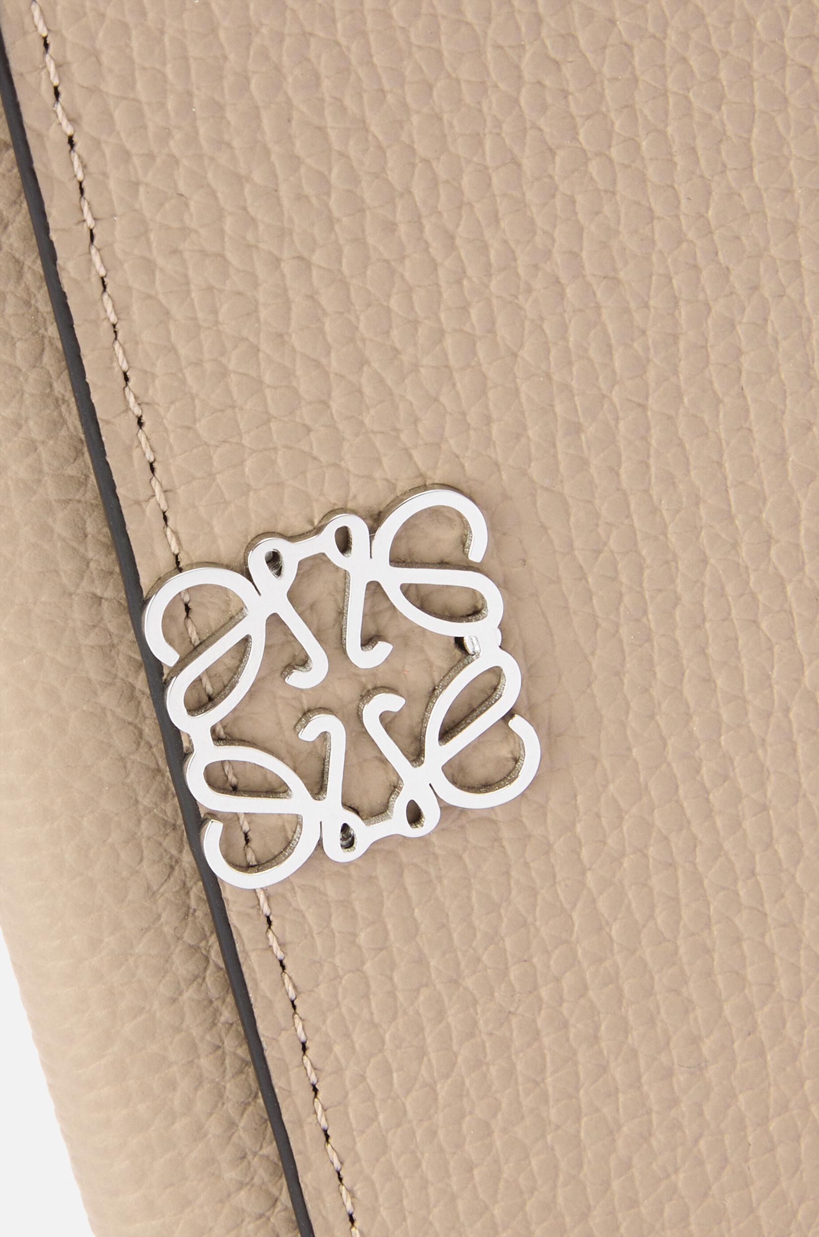 Anagram small vertical wallet in pebble grained calfskin Product Image