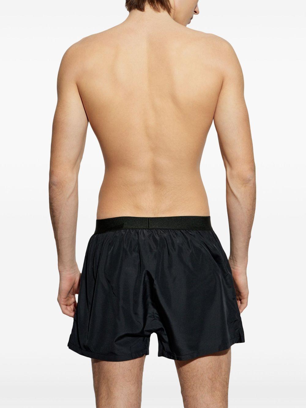 logo-waistband swim shorts Product Image
