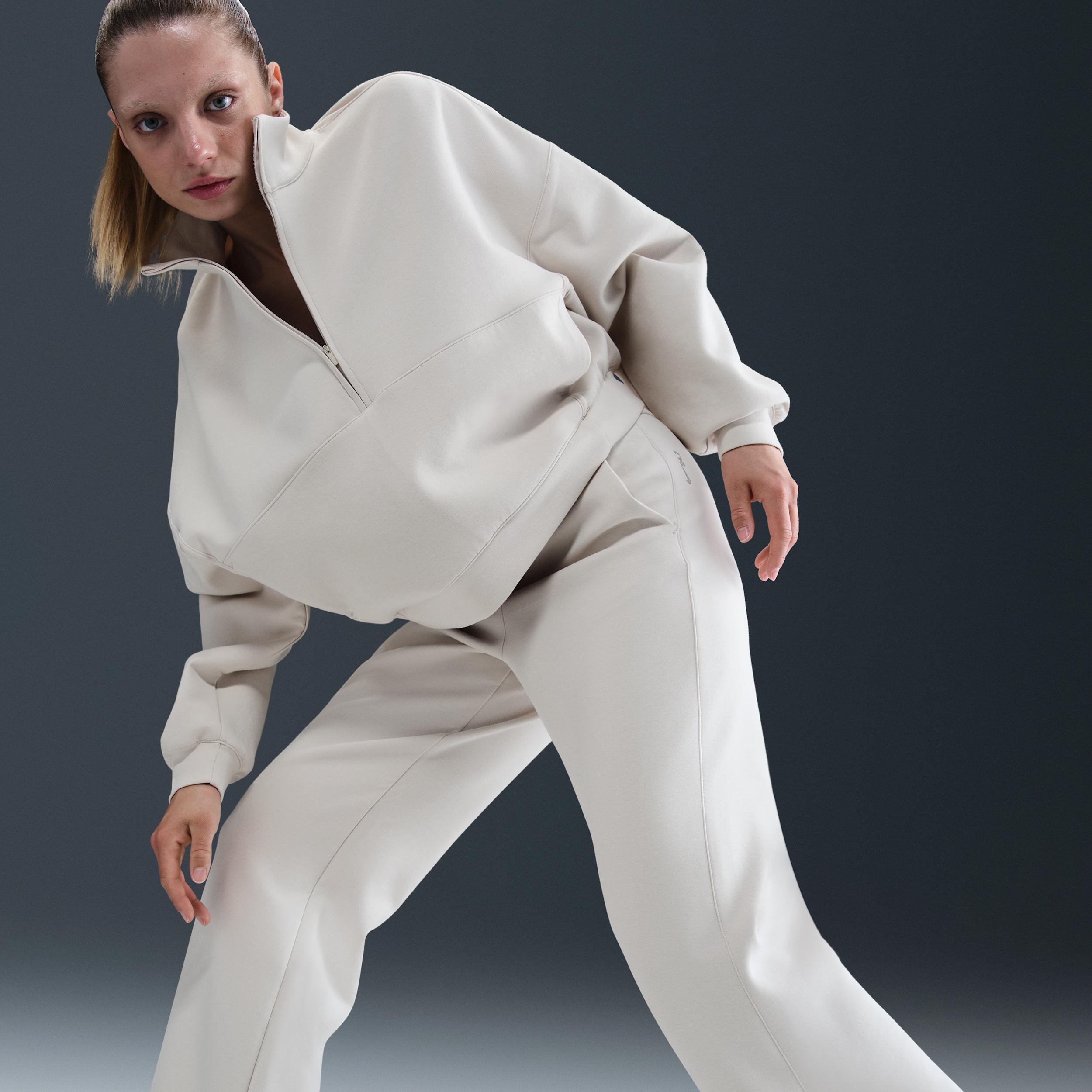 Nike Womens 24.7 ImpossiblySoft Dri-FIT High-Waisted Loose Flared Pants | HQ8607-104 Product Image