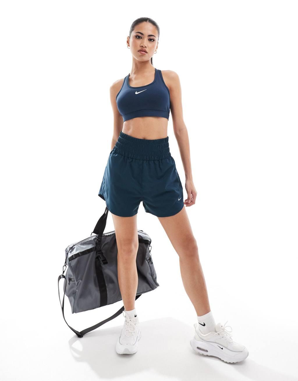 Nike Training Swoosh medium support sports bra in navy Product Image