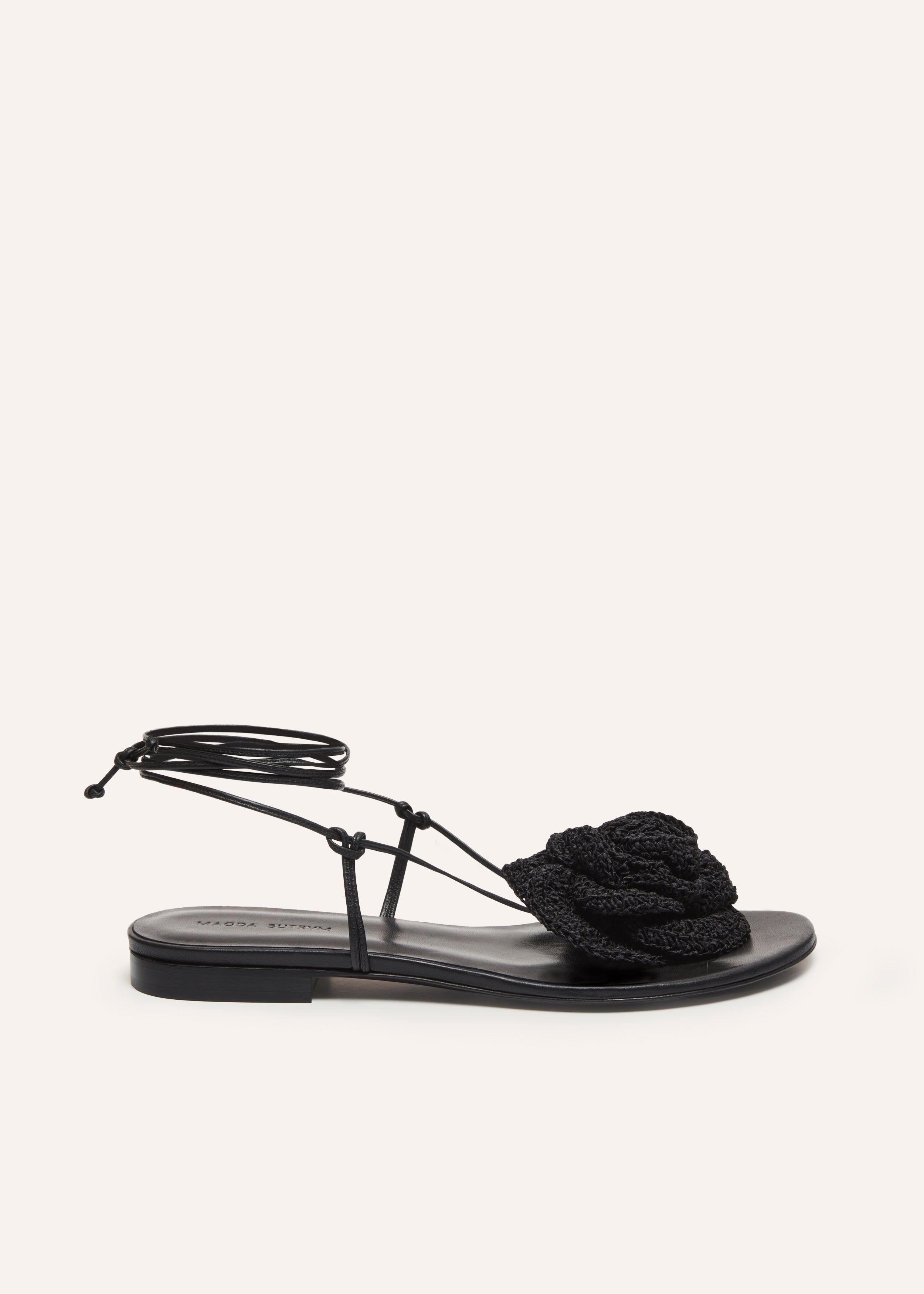 Wrap around flat flower sandals in black crochet Product Image