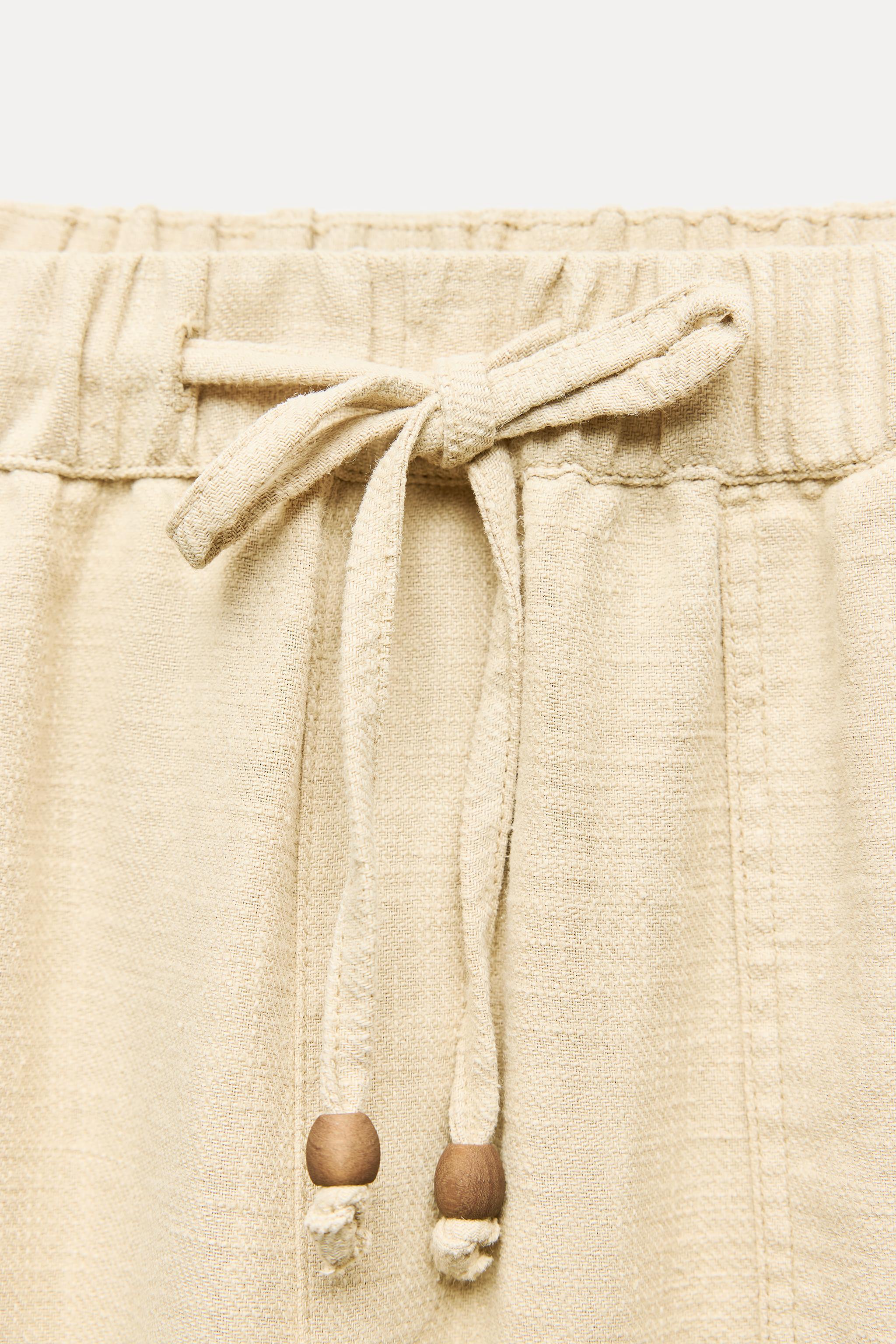 BUTTON HEM STRAIGHT LEG PANTS Product Image