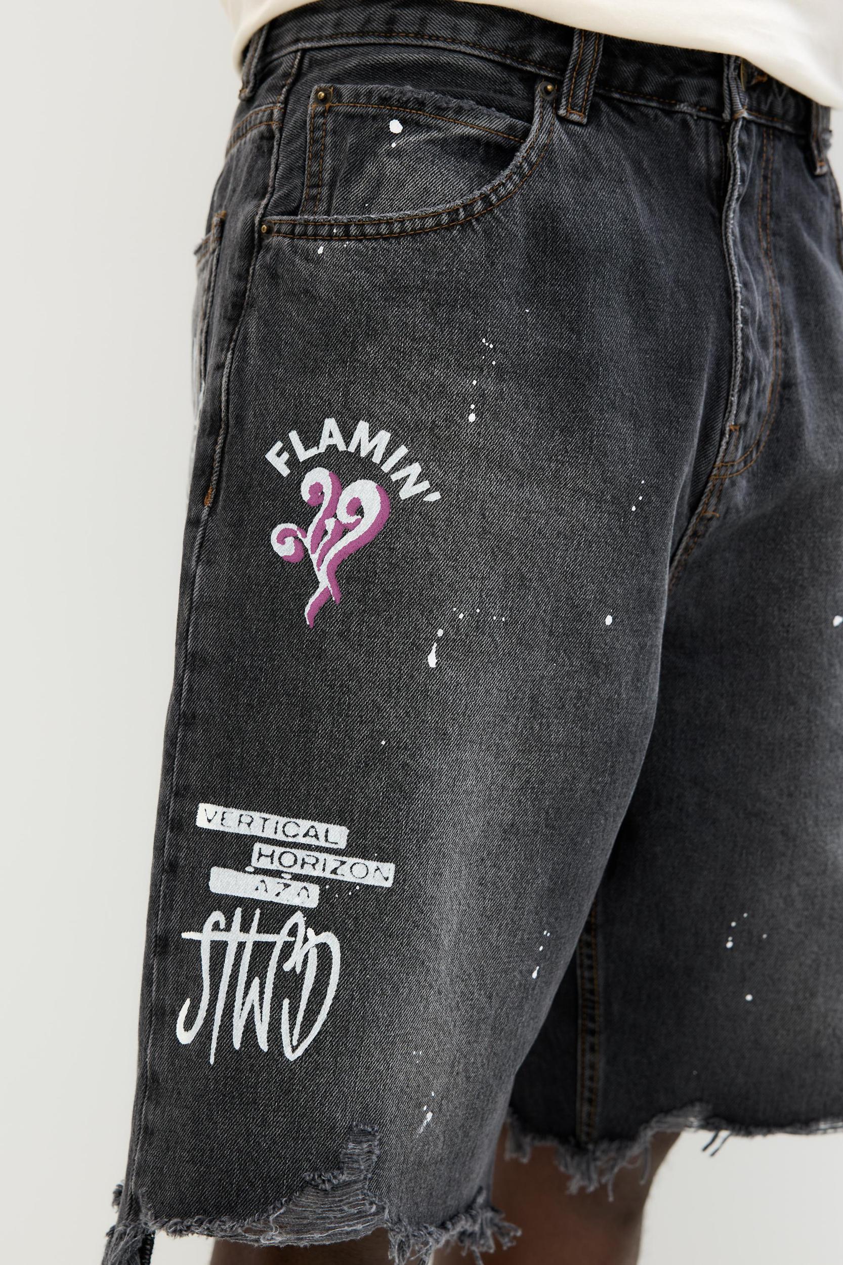 Ripped denim Bermuda shorts Product Image