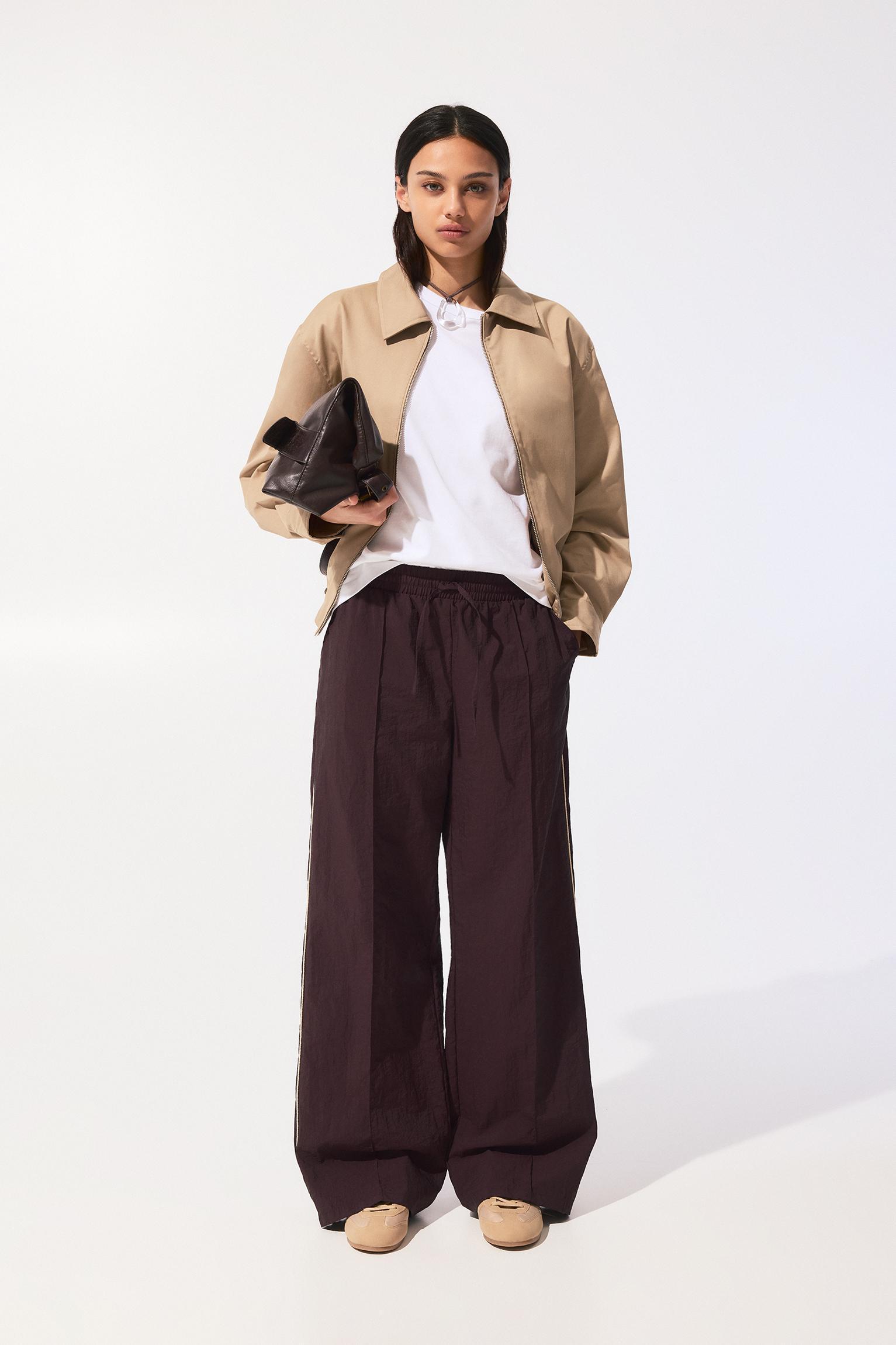 Tracksuit pants with side stripes Product Image