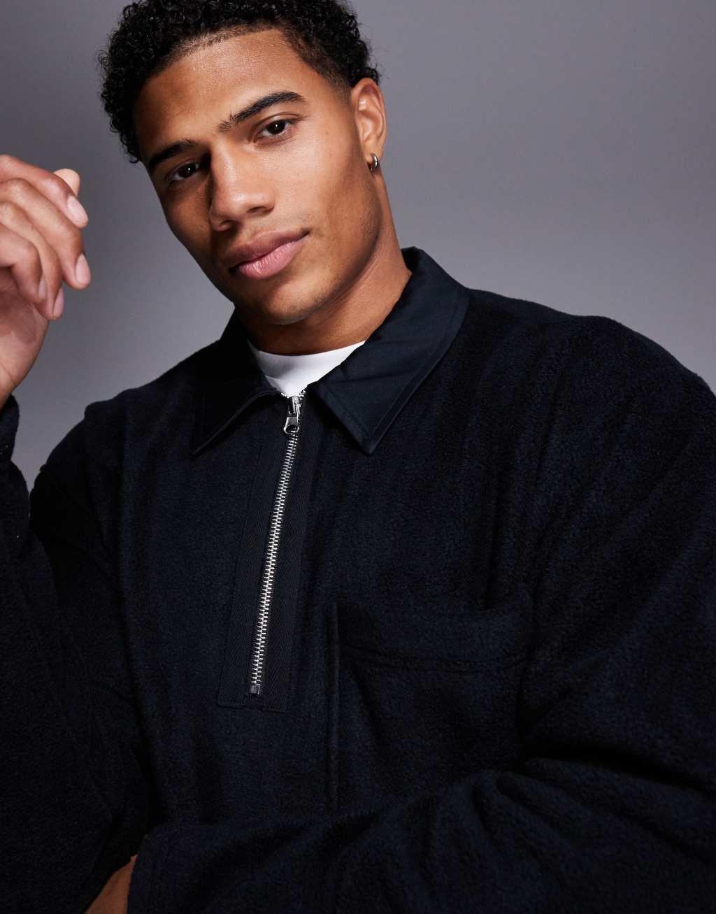 ASOS DESIGN oversized rugby polo fleece sweatshirt with quarter zip in black Product Image