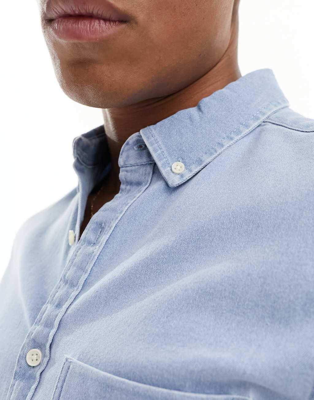 ASOS DESIGN slim roll sleeve denim shirt with button down collar in light blue wash Product Image