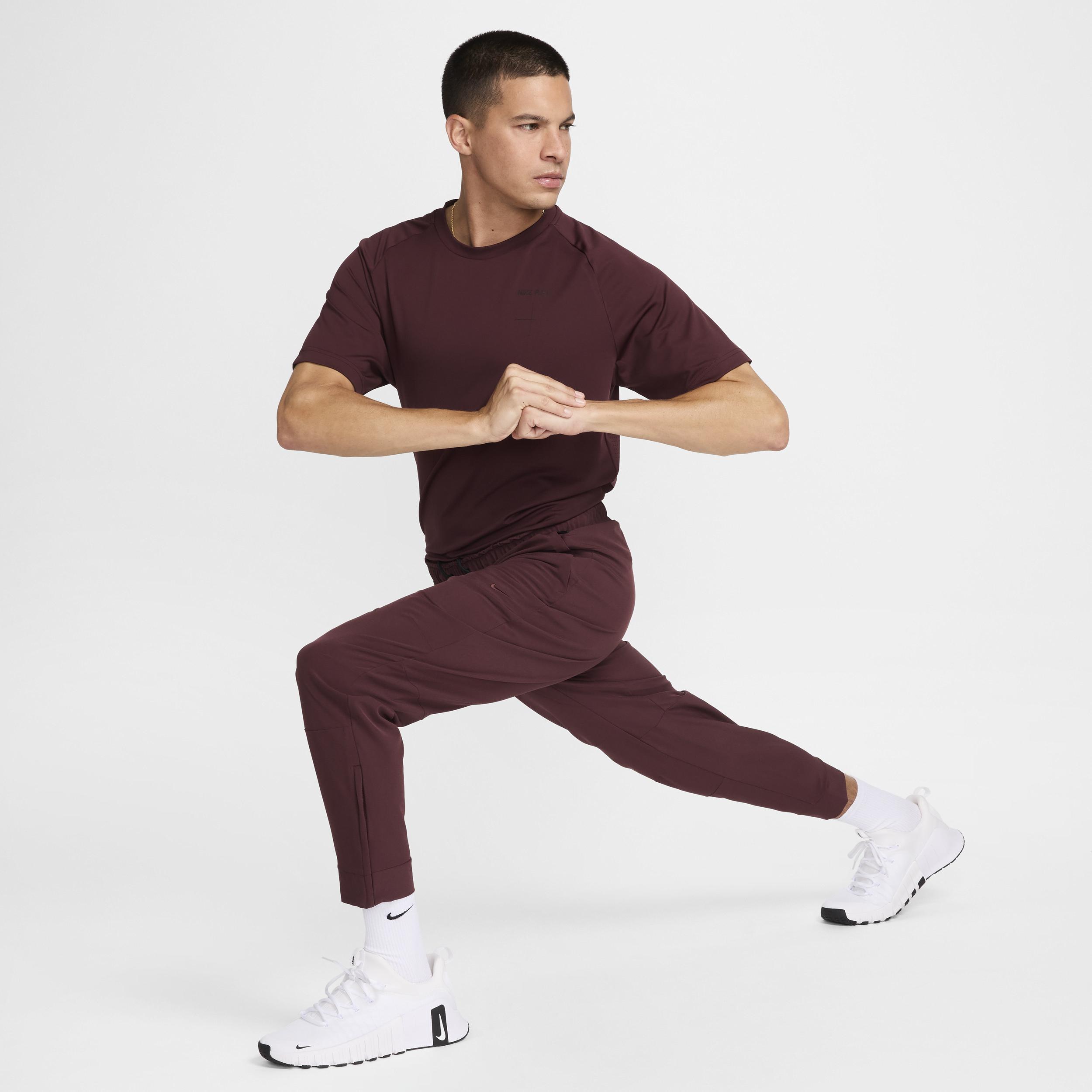 Nike Men's Unlimited Dri-FIT Zippered Cuff Versatile Pants Product Image