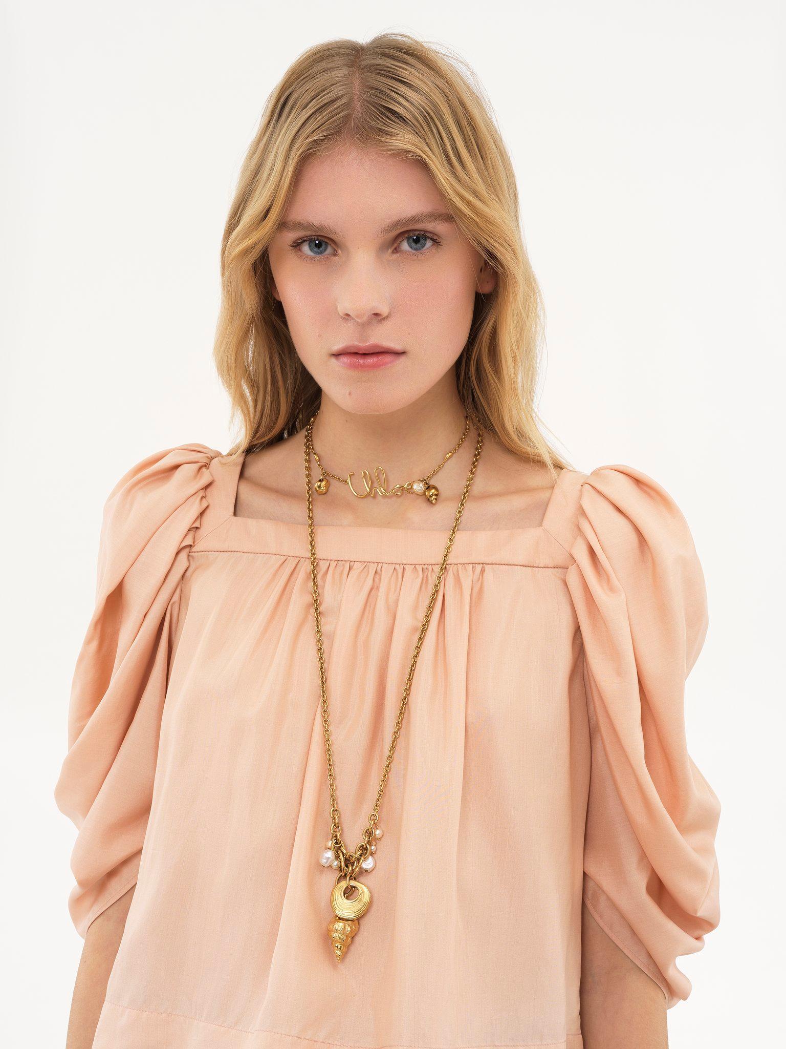 Puff-sleeve pleated top in silk poplin Product Image
