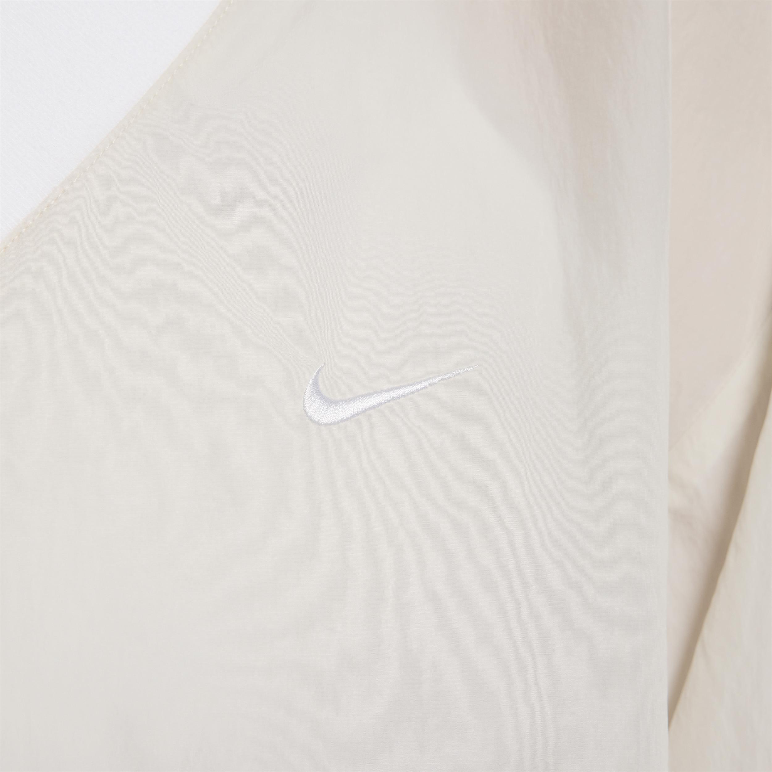 Women's Nike Sportswear Essential Loose UV Woven Long-Sleeve V-Neck Top Product Image