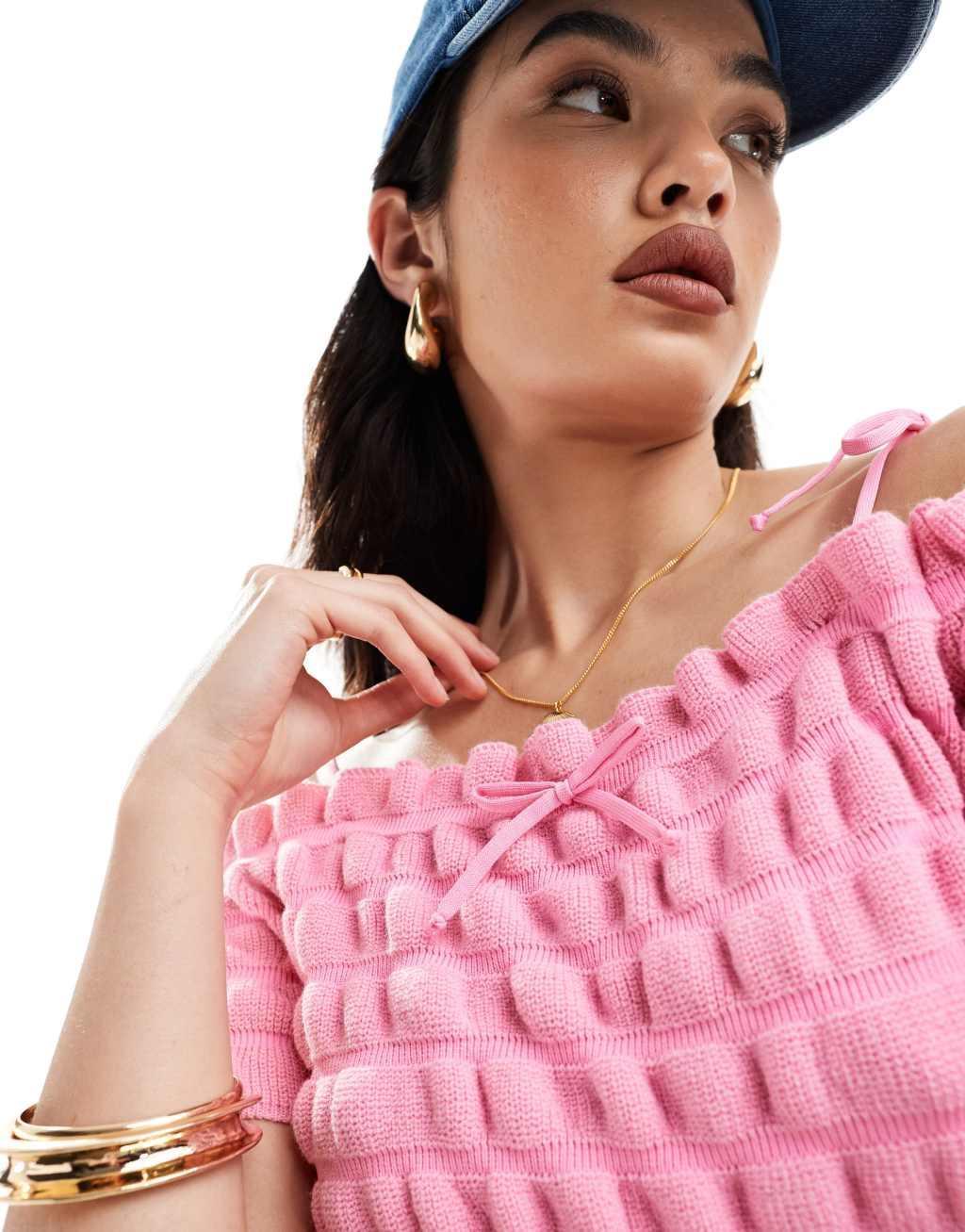 ASOS DESIGN knitted shirred bardot top with tie strap and bow detail in pink Product Image