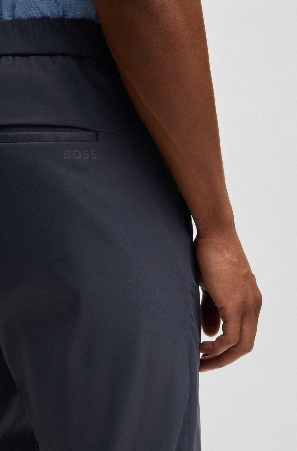 Regular-fit chinos with hidden drawcord and tapered leg Product Image