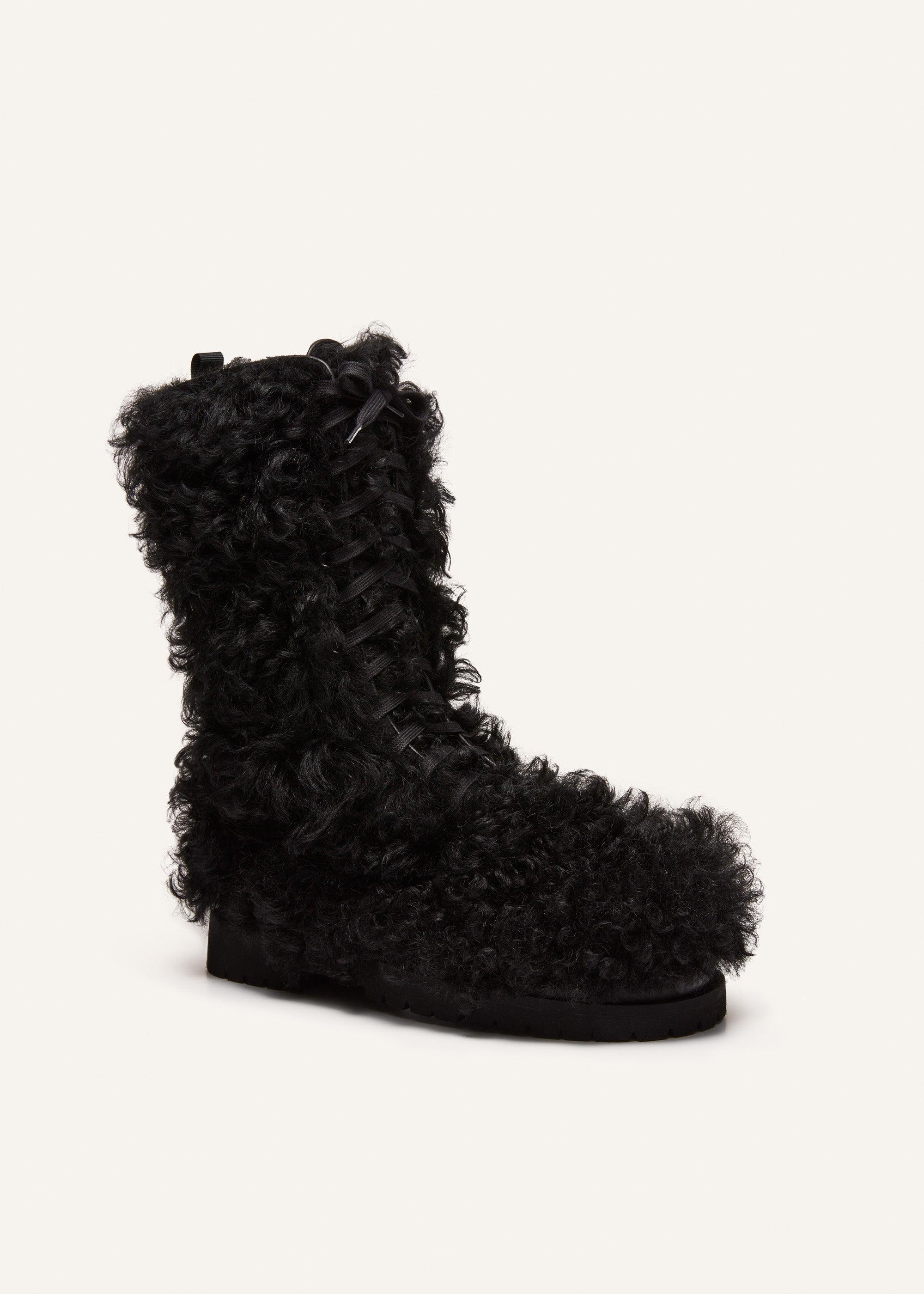 Shearling combat boots in black Product Image