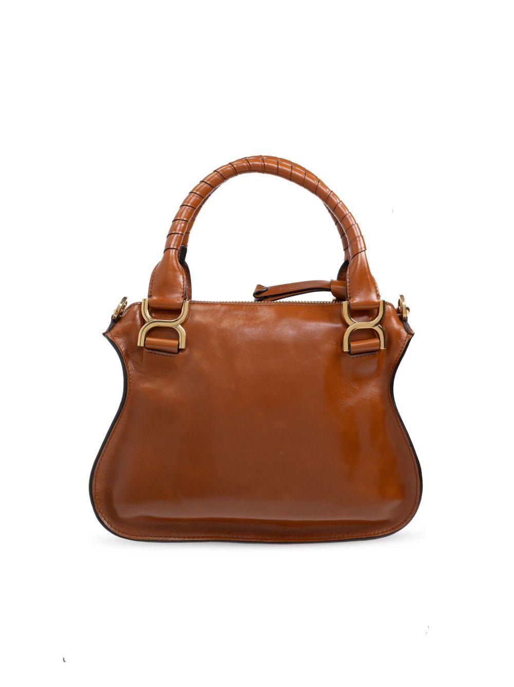 Leather Tote Bag In Detail Of Gold Buckles And Double Hand-wrapped Handles Product Image